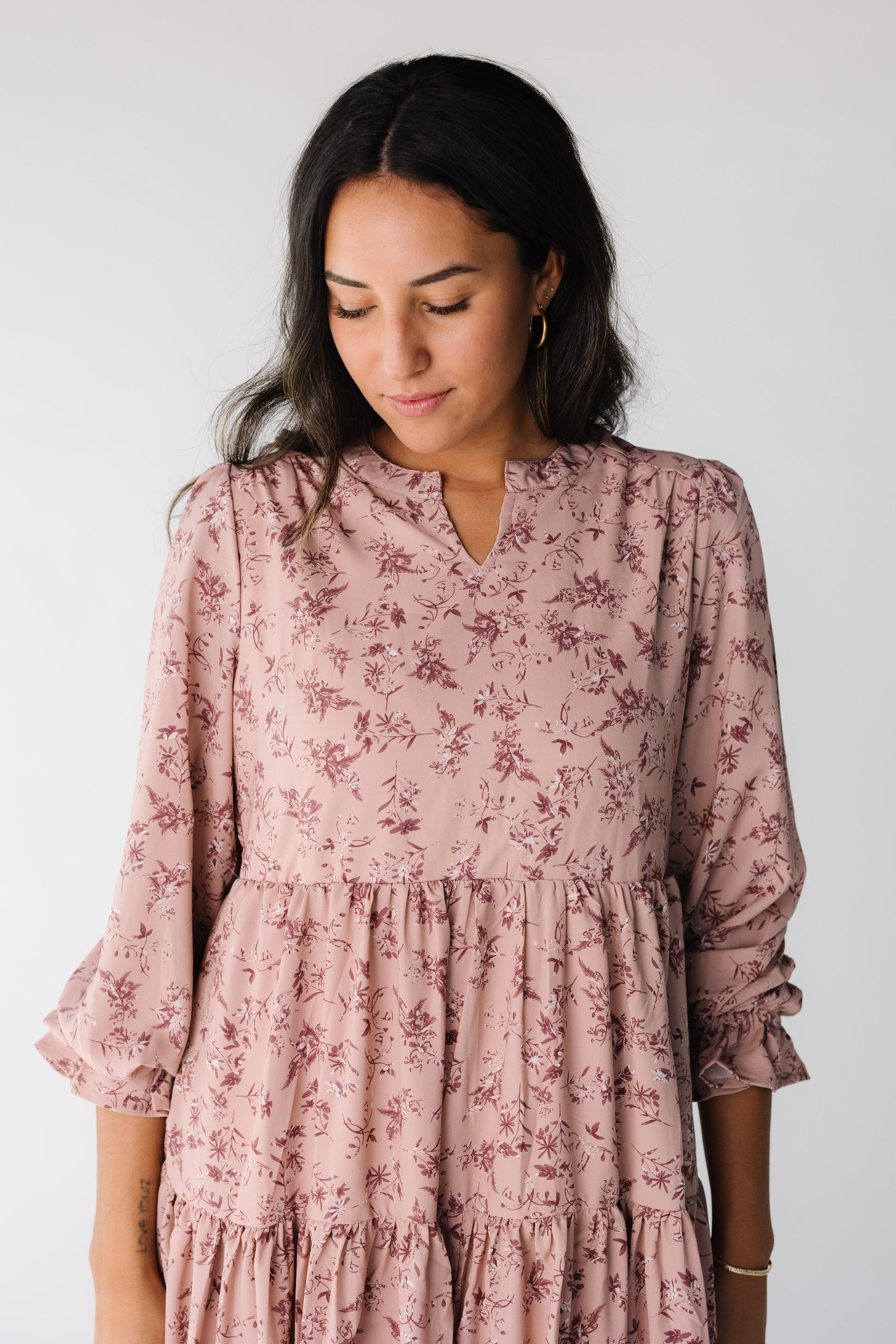 Close view of a woman wearing a pink floral dress
