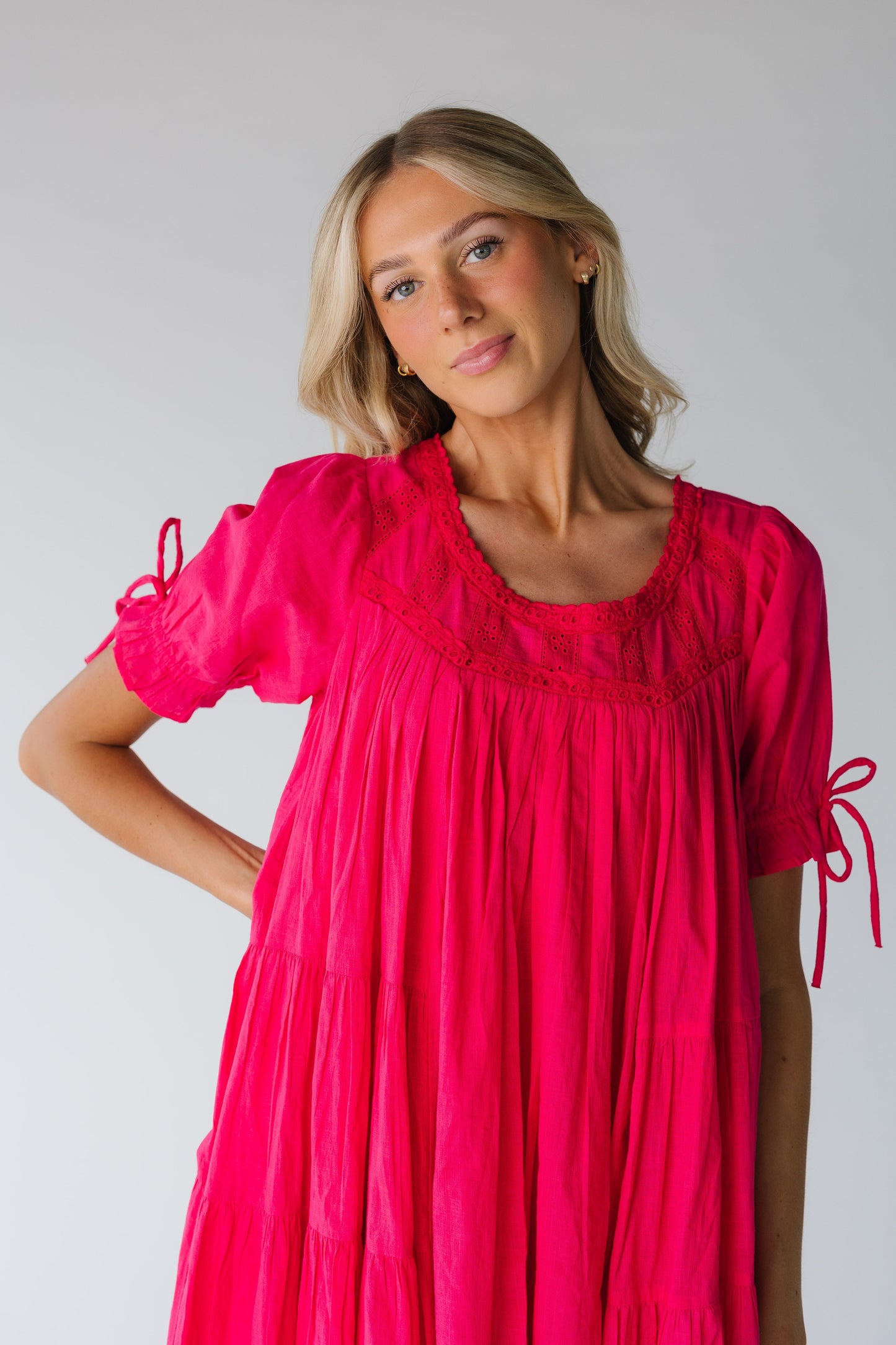 Close view of pink lace inset dress with short sleeves