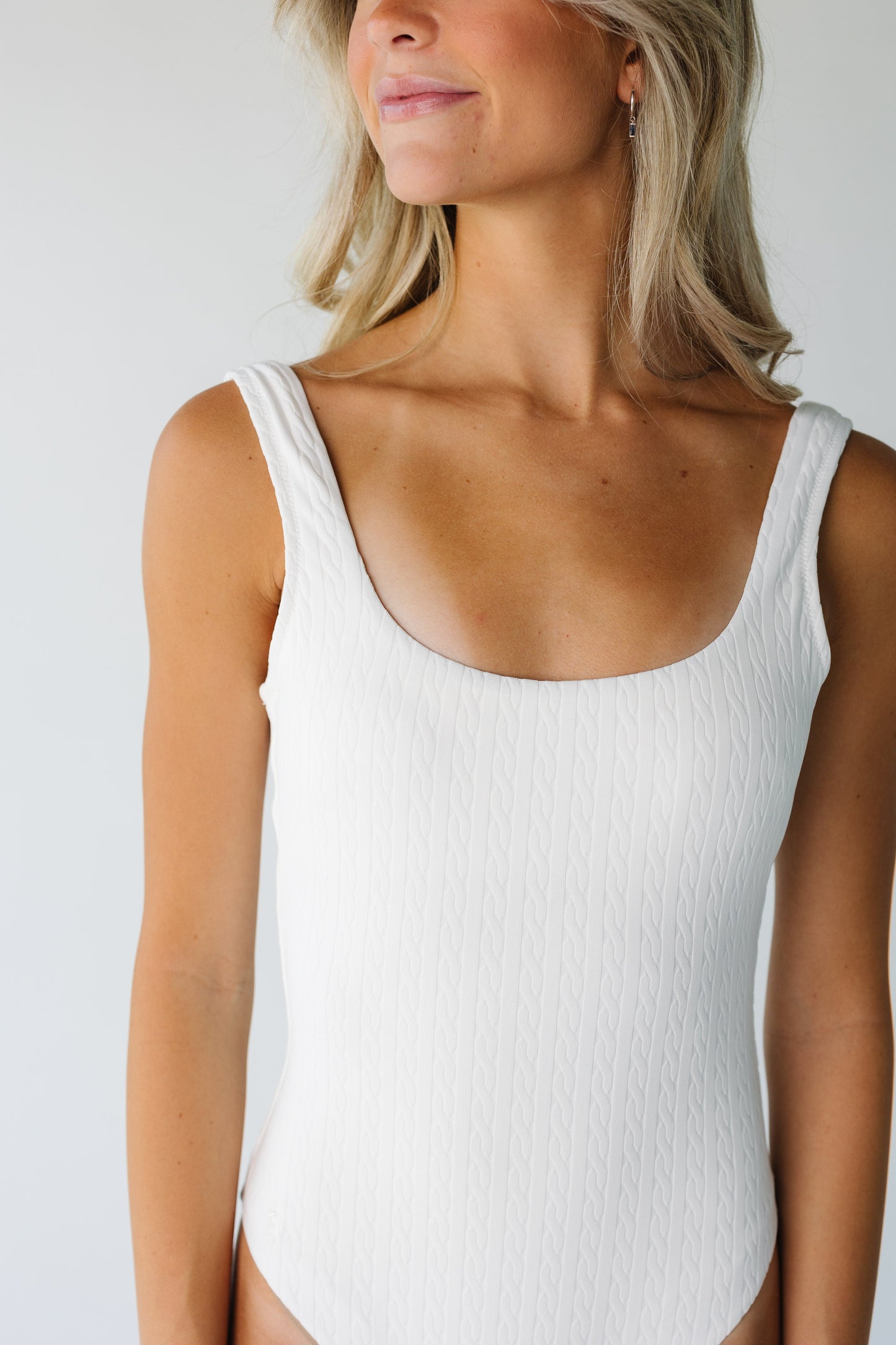 Close view of white textured one piece