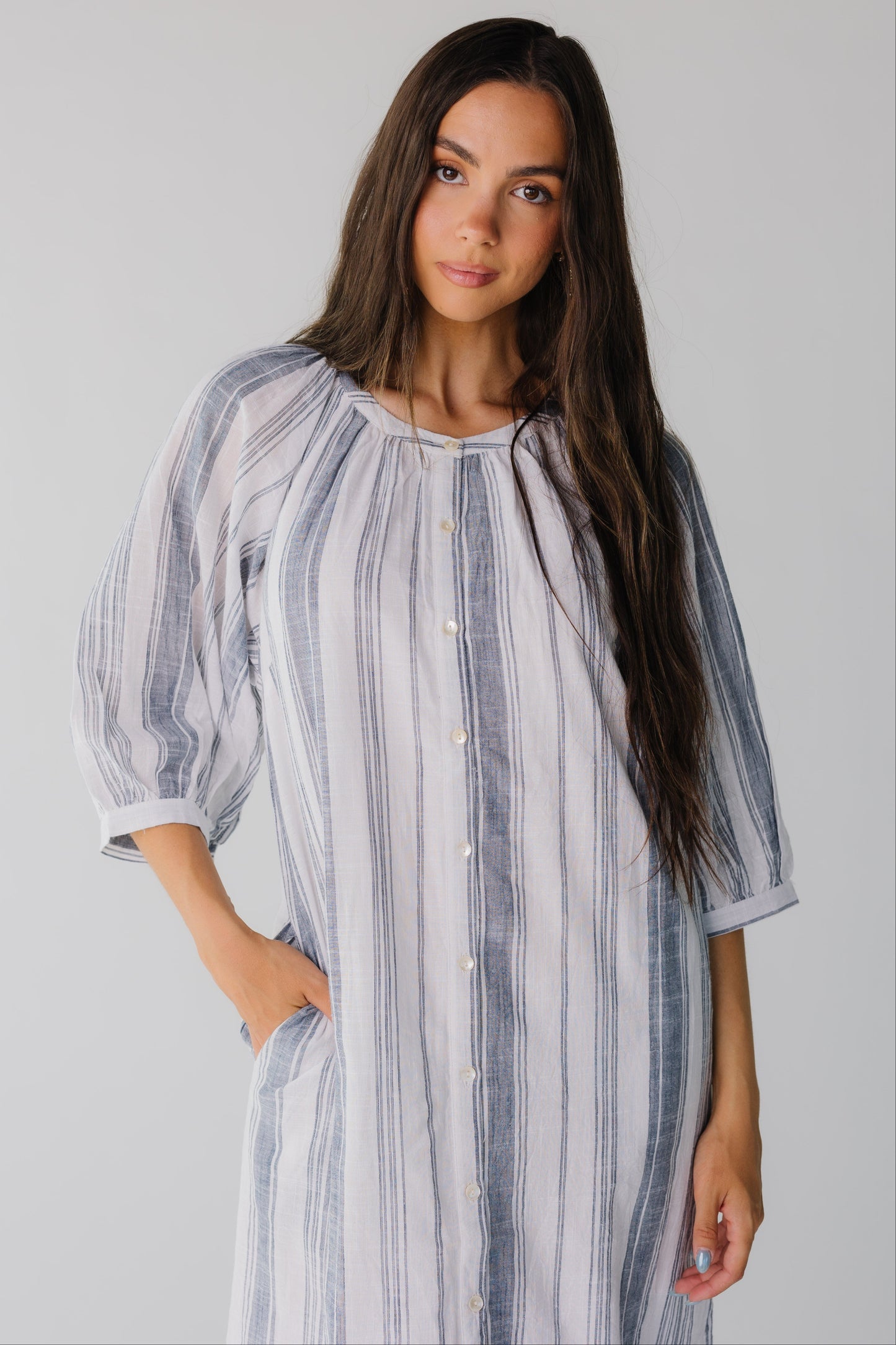 Stripe button down dress with three quarter length sleeves and side pockets