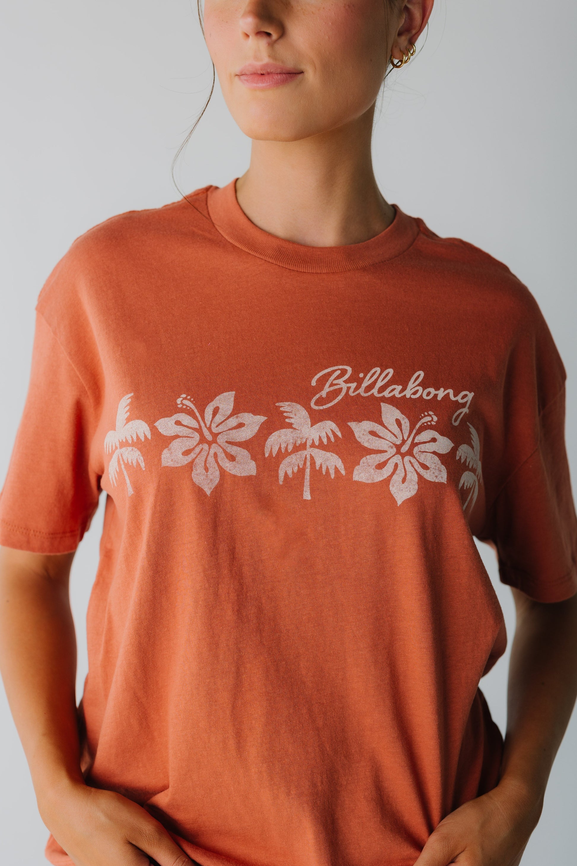 Close view of Billabong graphic tee in rust