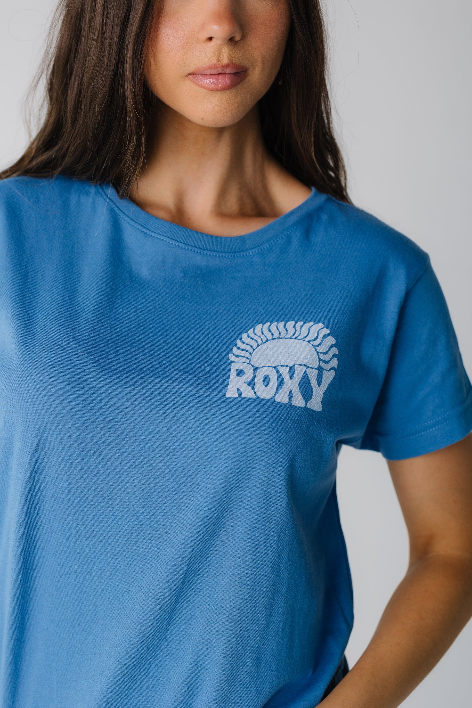 Close view of blue Roxy graphic tee with small front graphic