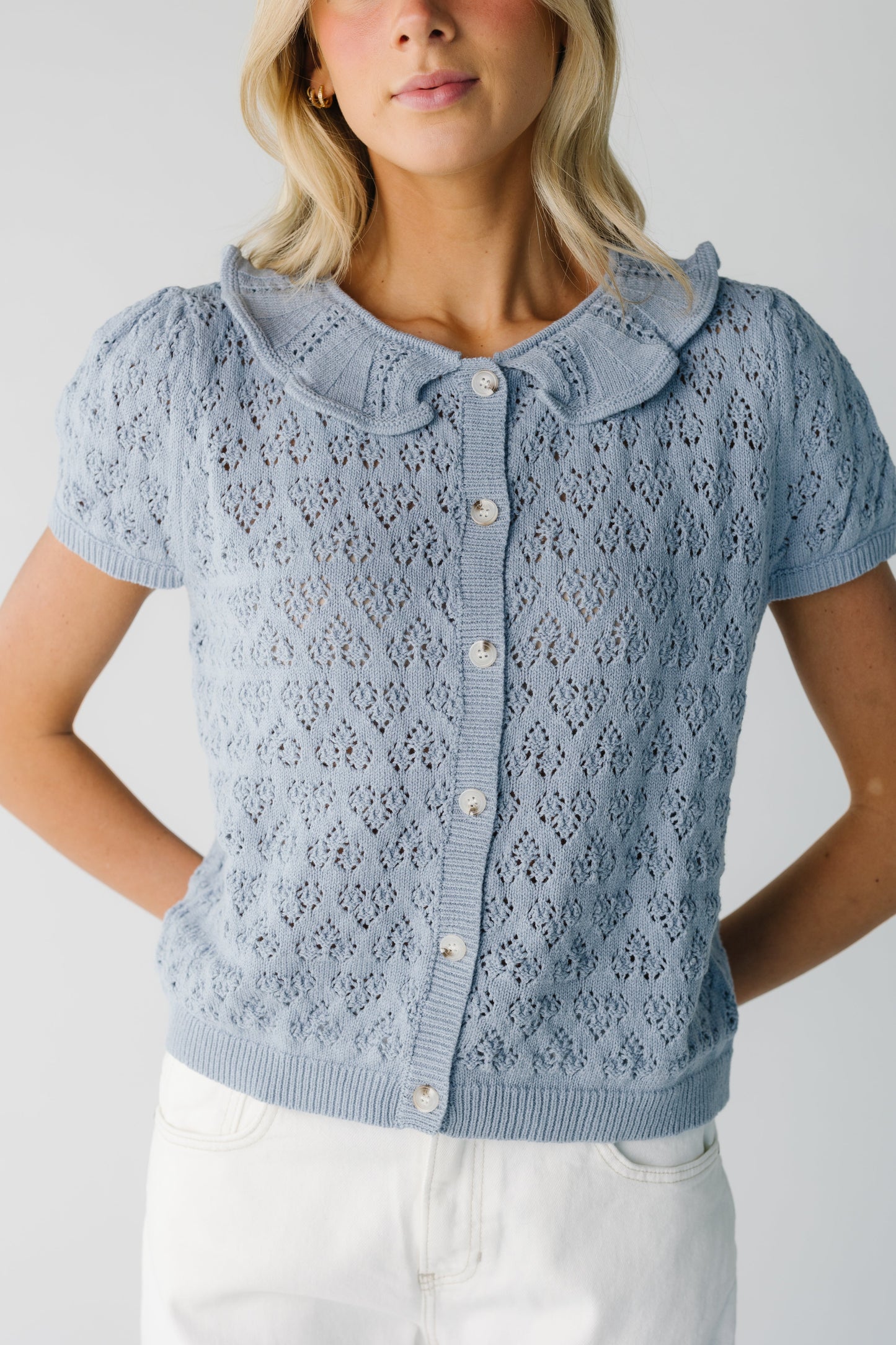 Blue lace knit cardigan with ruffled round neckline and short puff sleeves