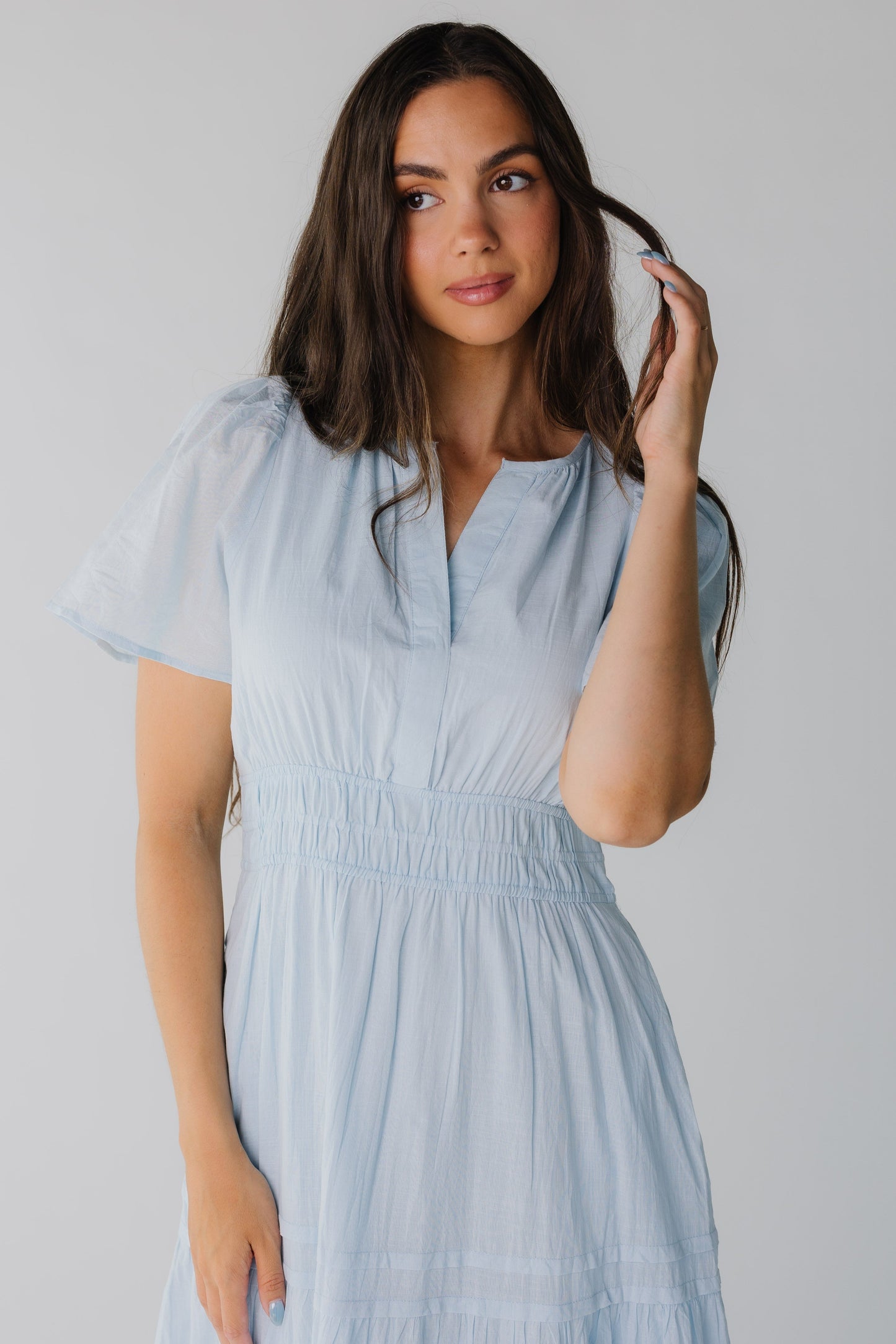 Close view of light blue maxi with V-neckline and short sleeves