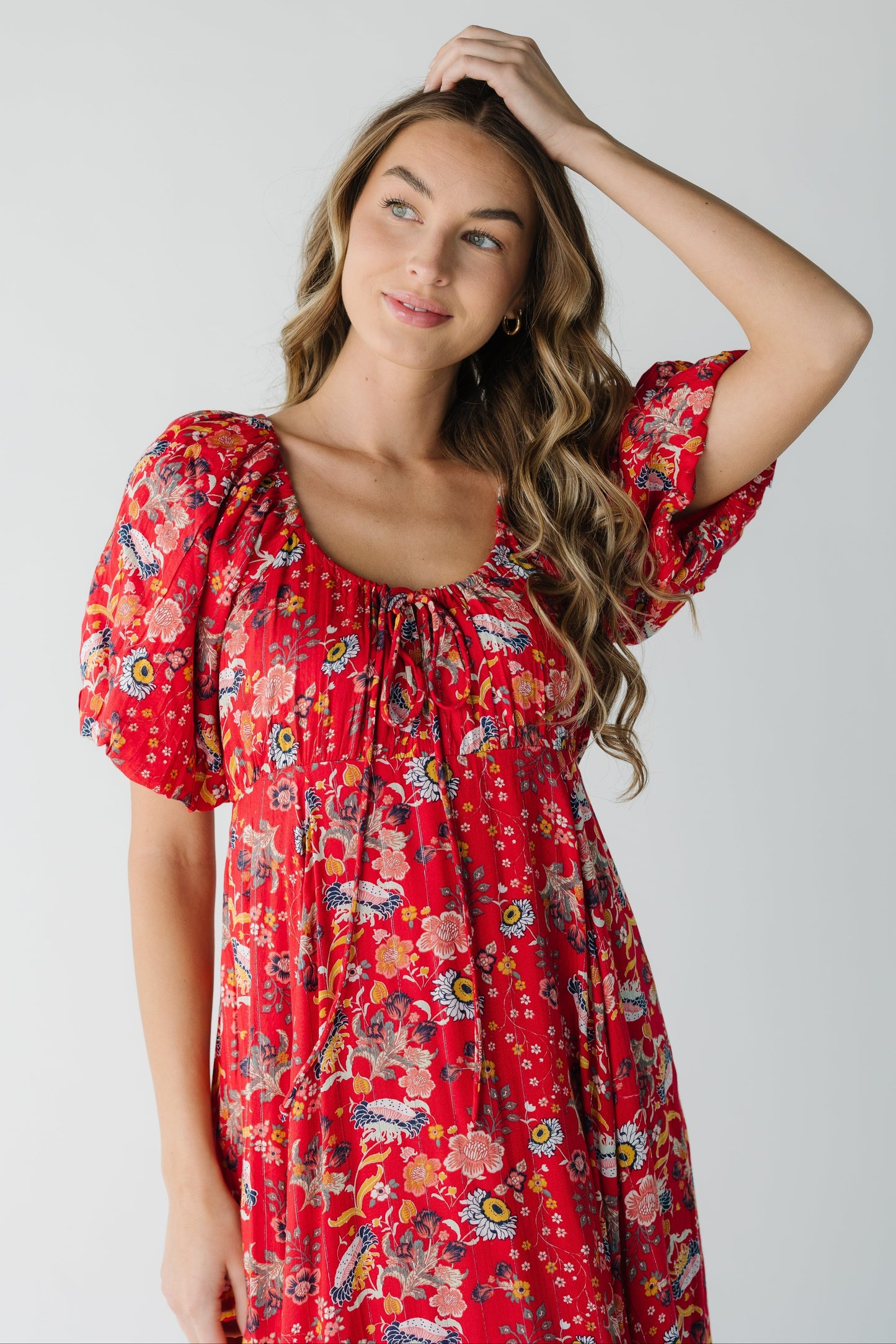Close view of red print dress with scoop neckline with short sleeves