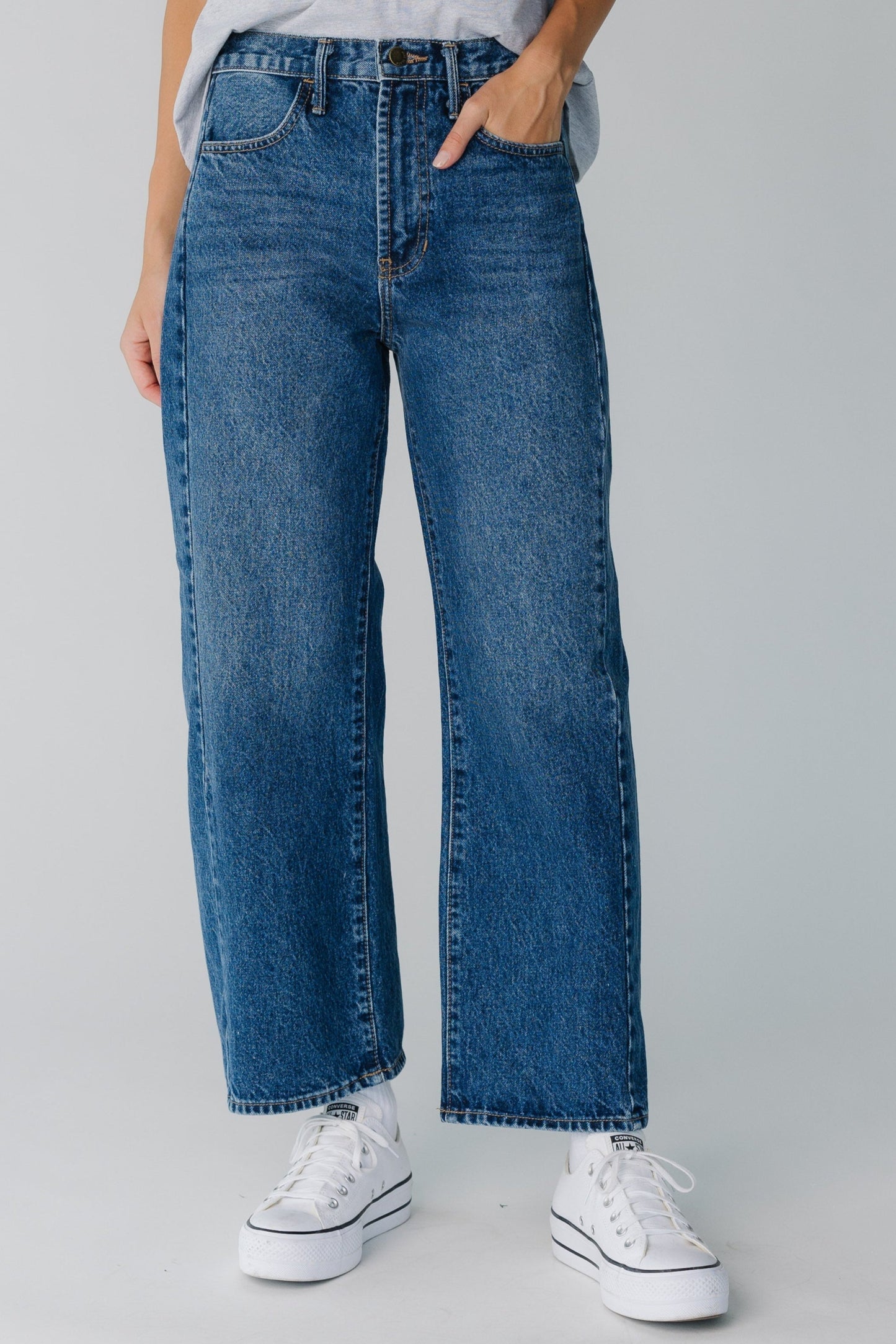 Modest full length dark denim jeans with wide cut legs
