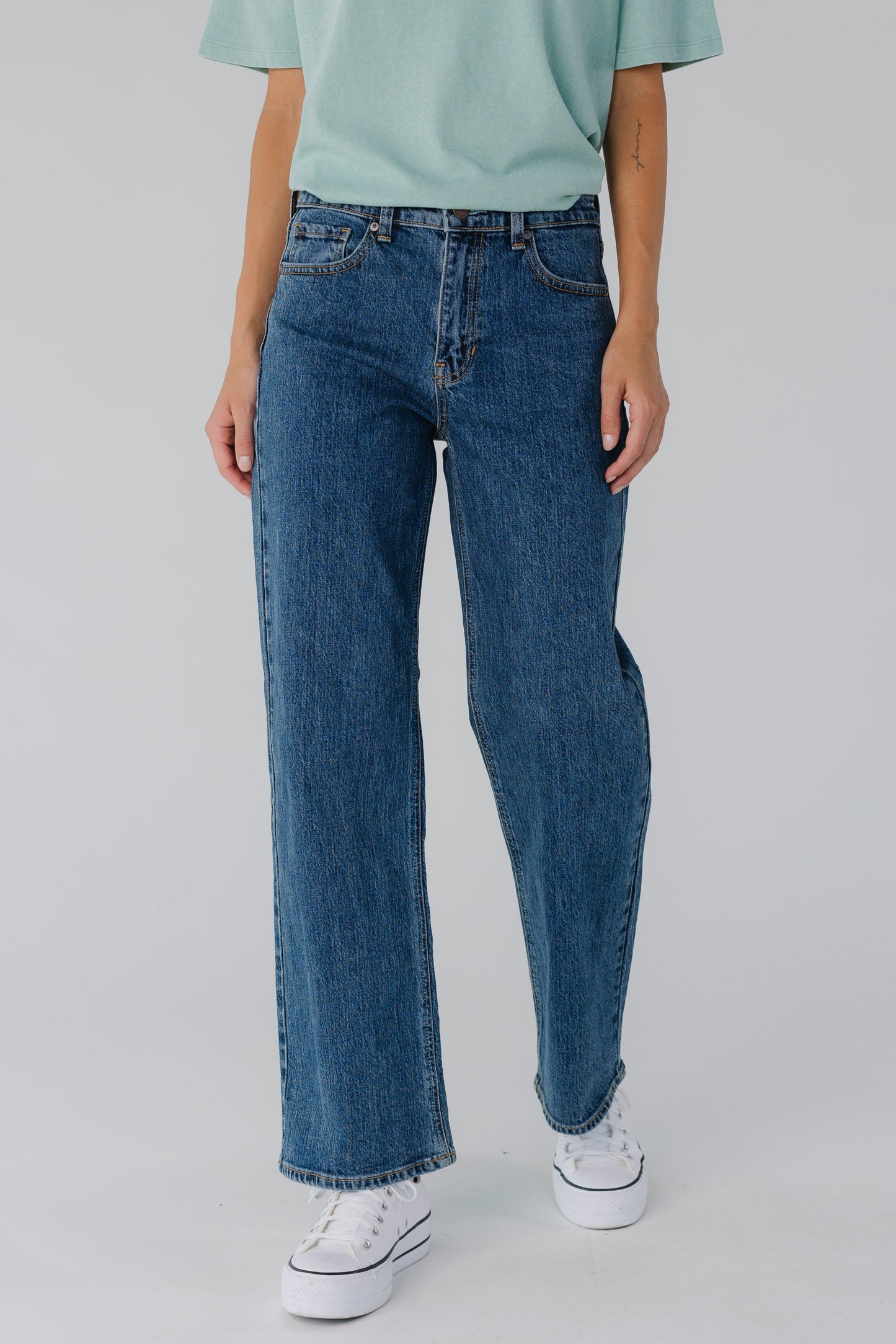 Modest women's dark denim full length jeans