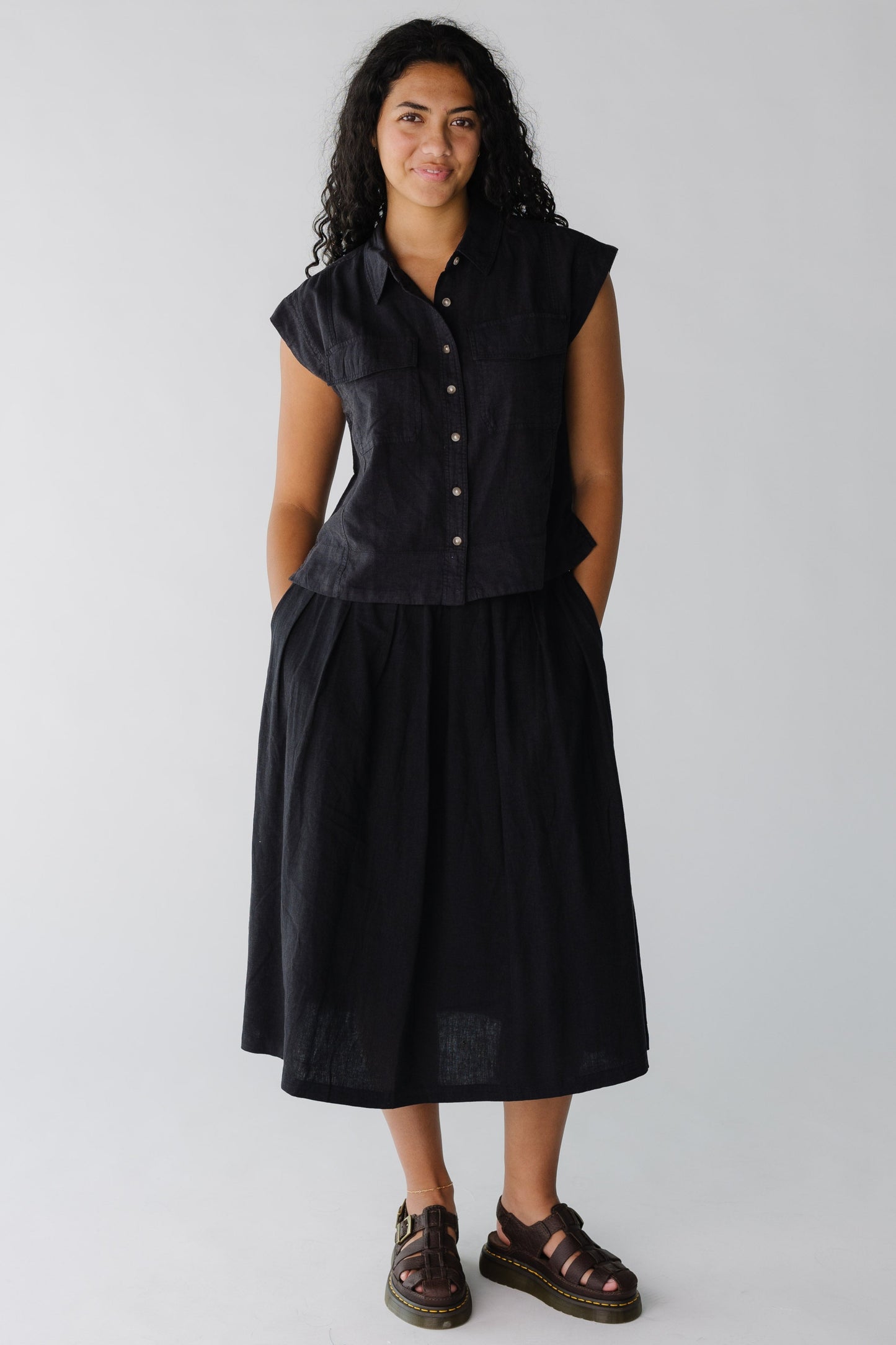 Modest black midi skirt with side pockets