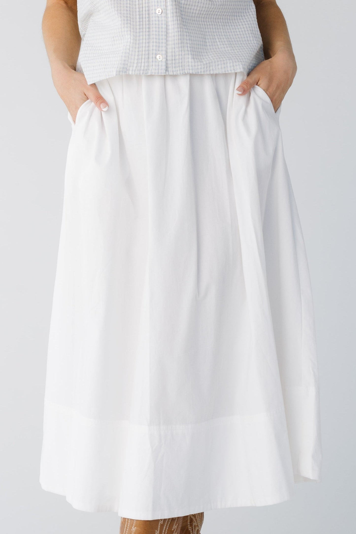Close view of white woven pocket skirt