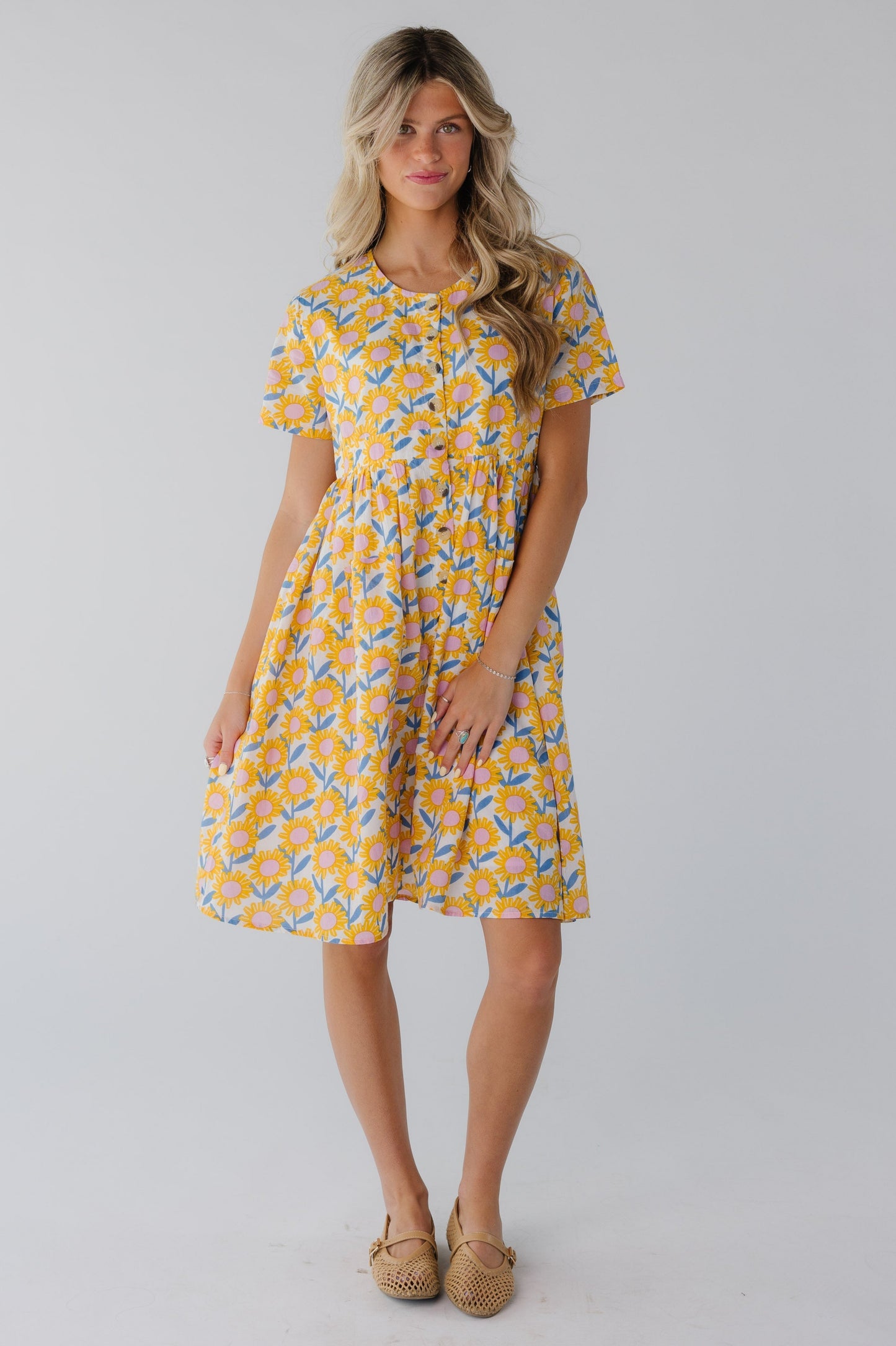 Modest floral knee length dress with round neckline and short sleeves