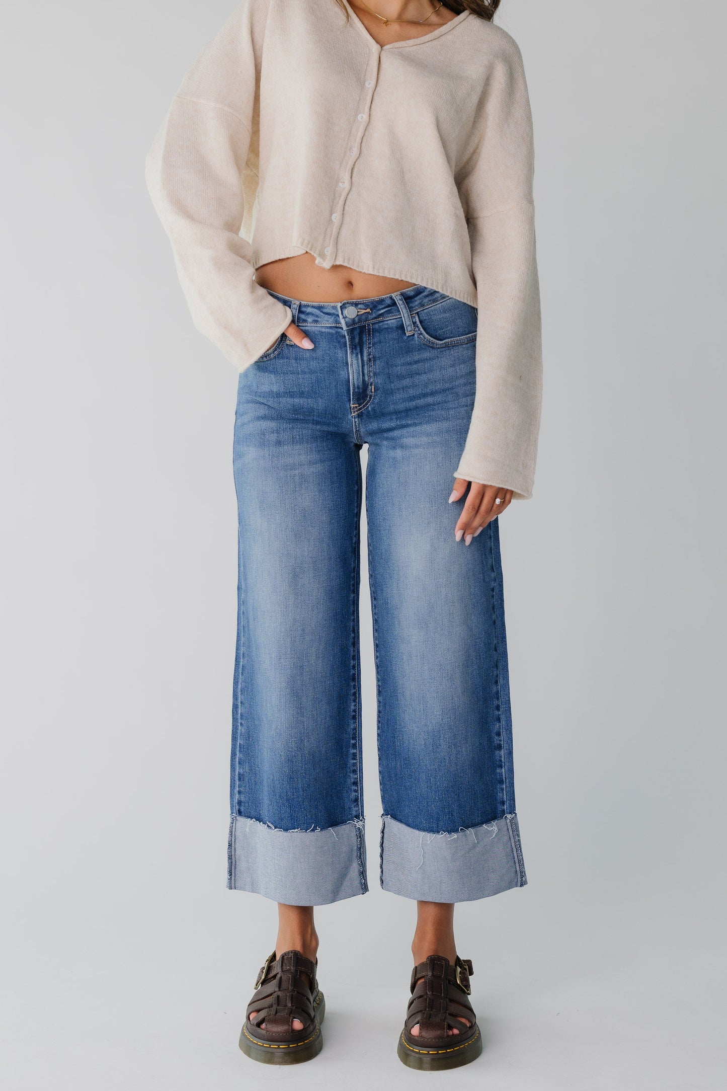 Wide leg jeans with button and zipper closure and pockets