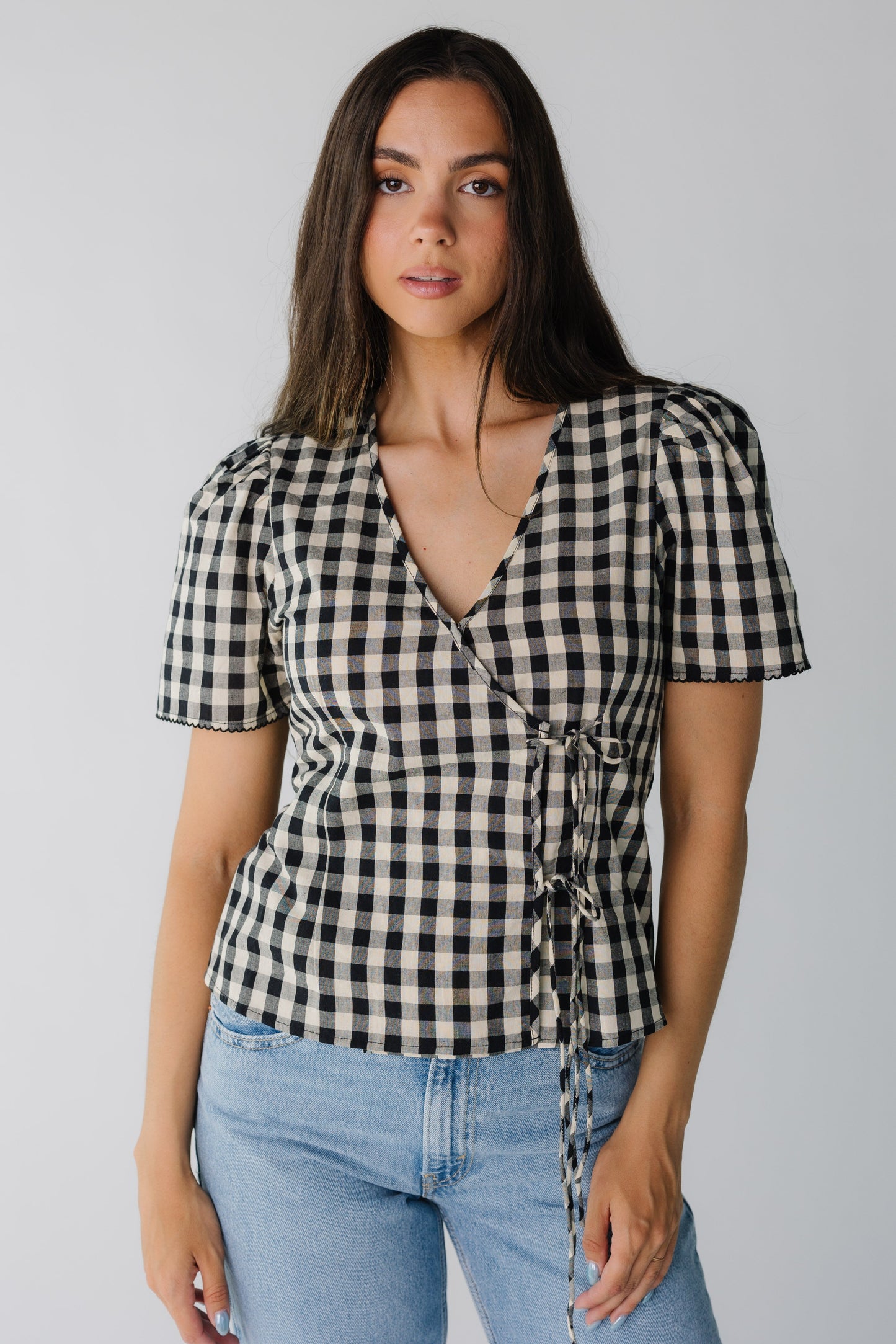 Modest black and cream wrap top with V-neckline and short sleeves