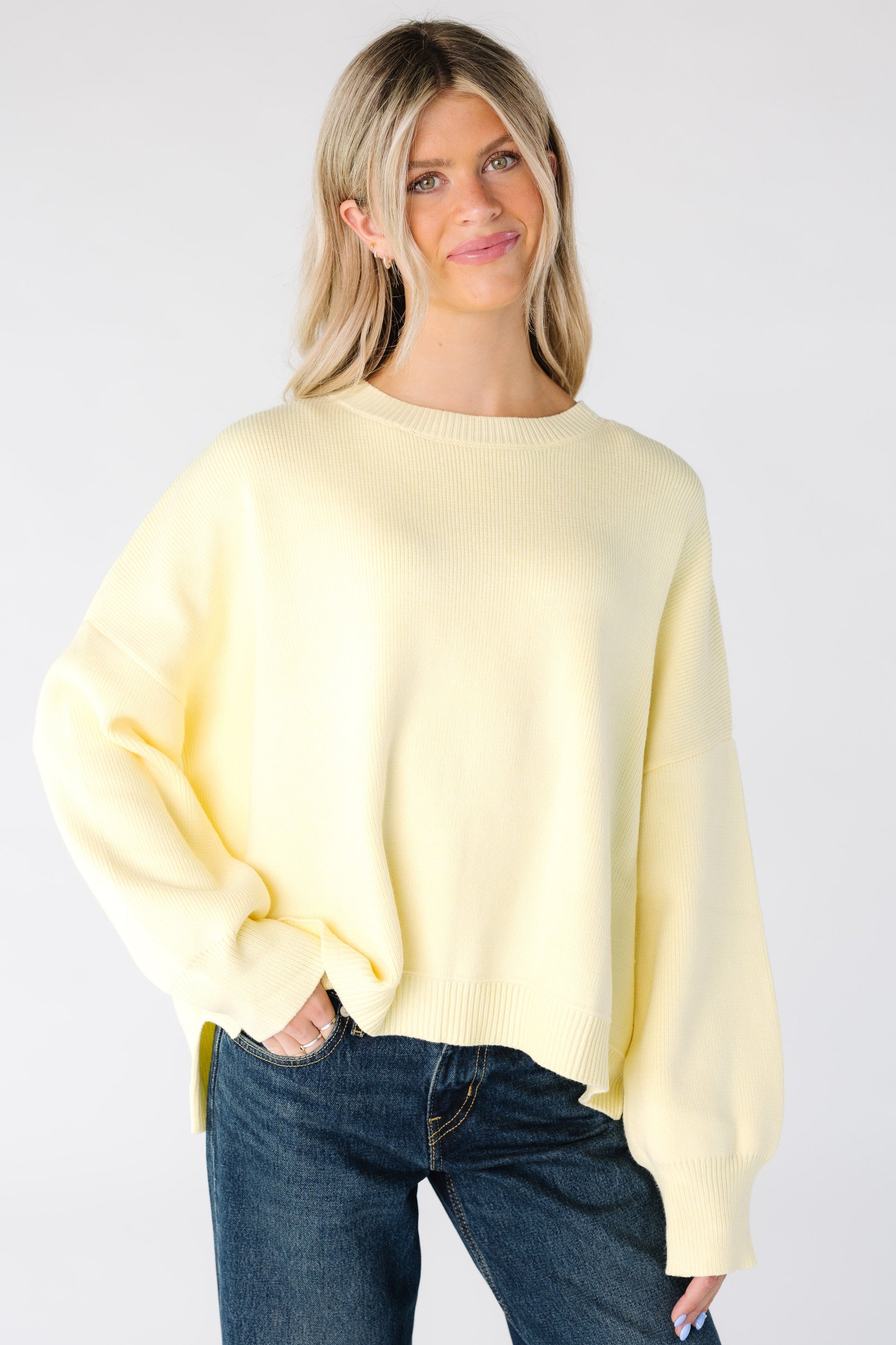 Modest women's loose sweater in light yellow with long sleeves