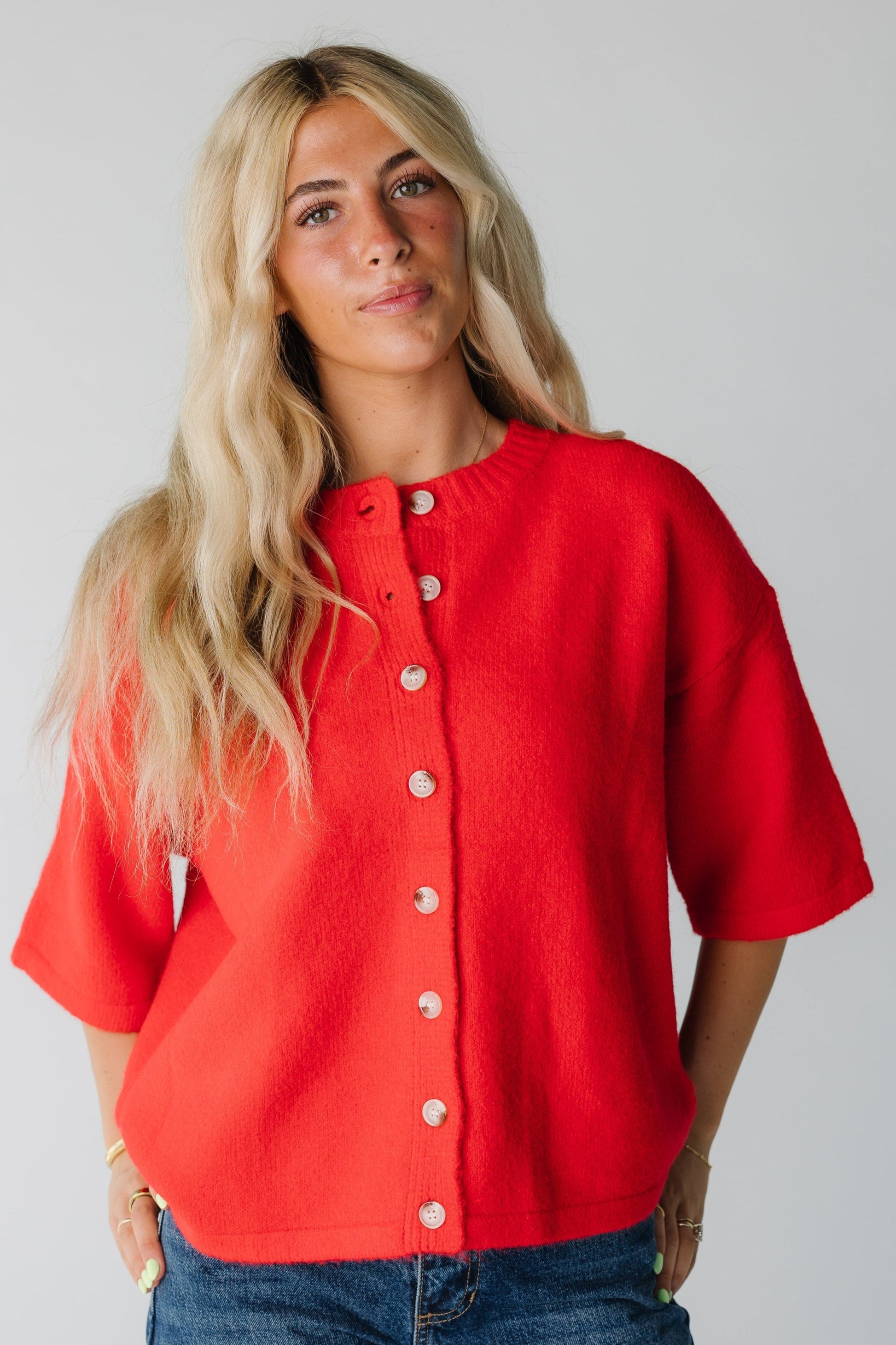 Modest women's red cardigan with crew neckline and half length sleeves
