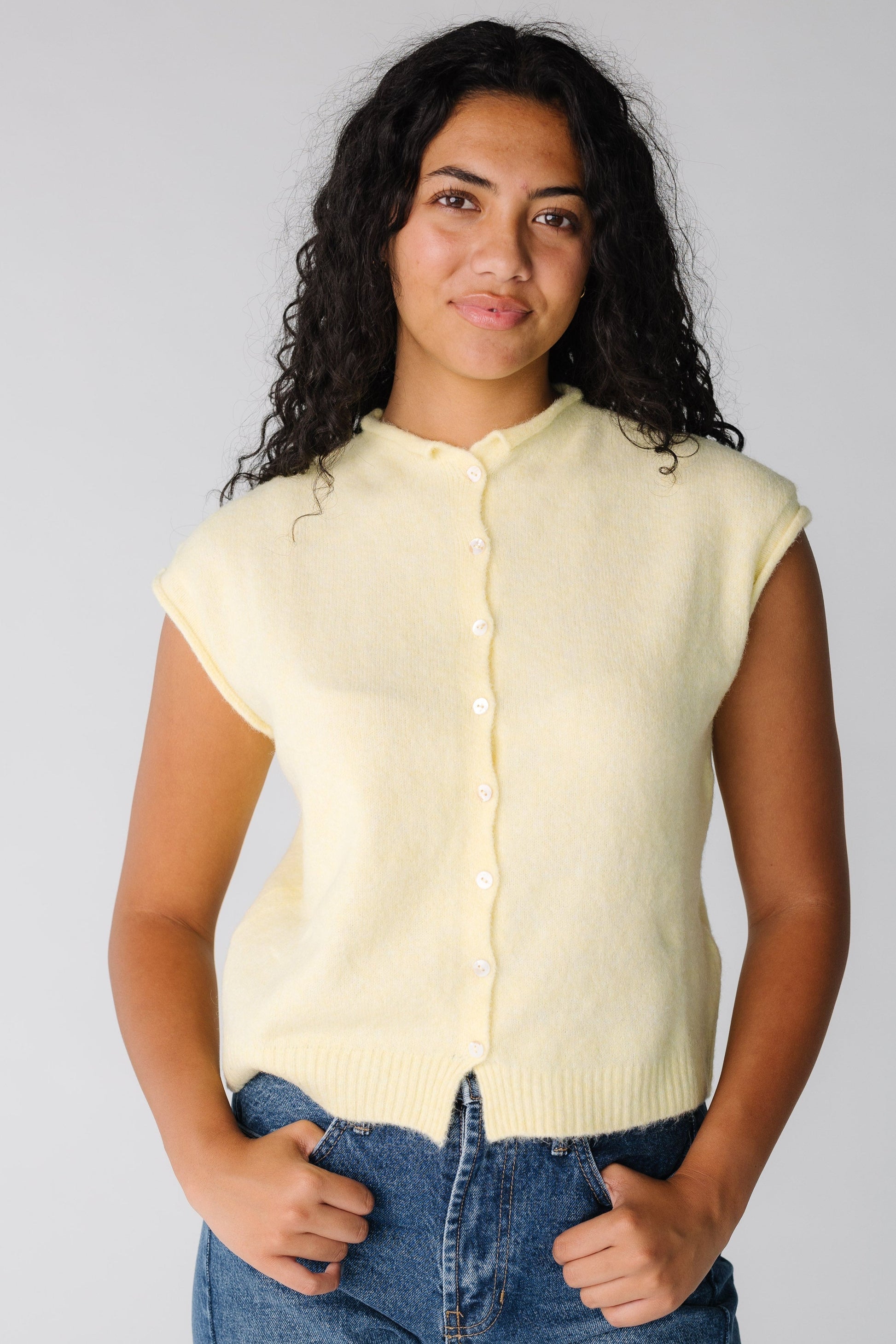 Modest light yellow women's sweater vest with round neckline