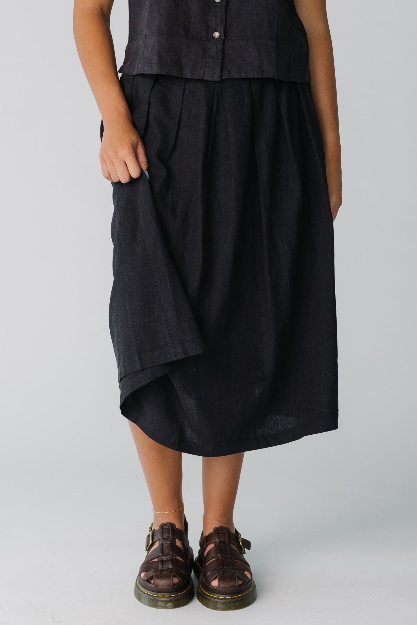 Loose fitting pleated midi skirt