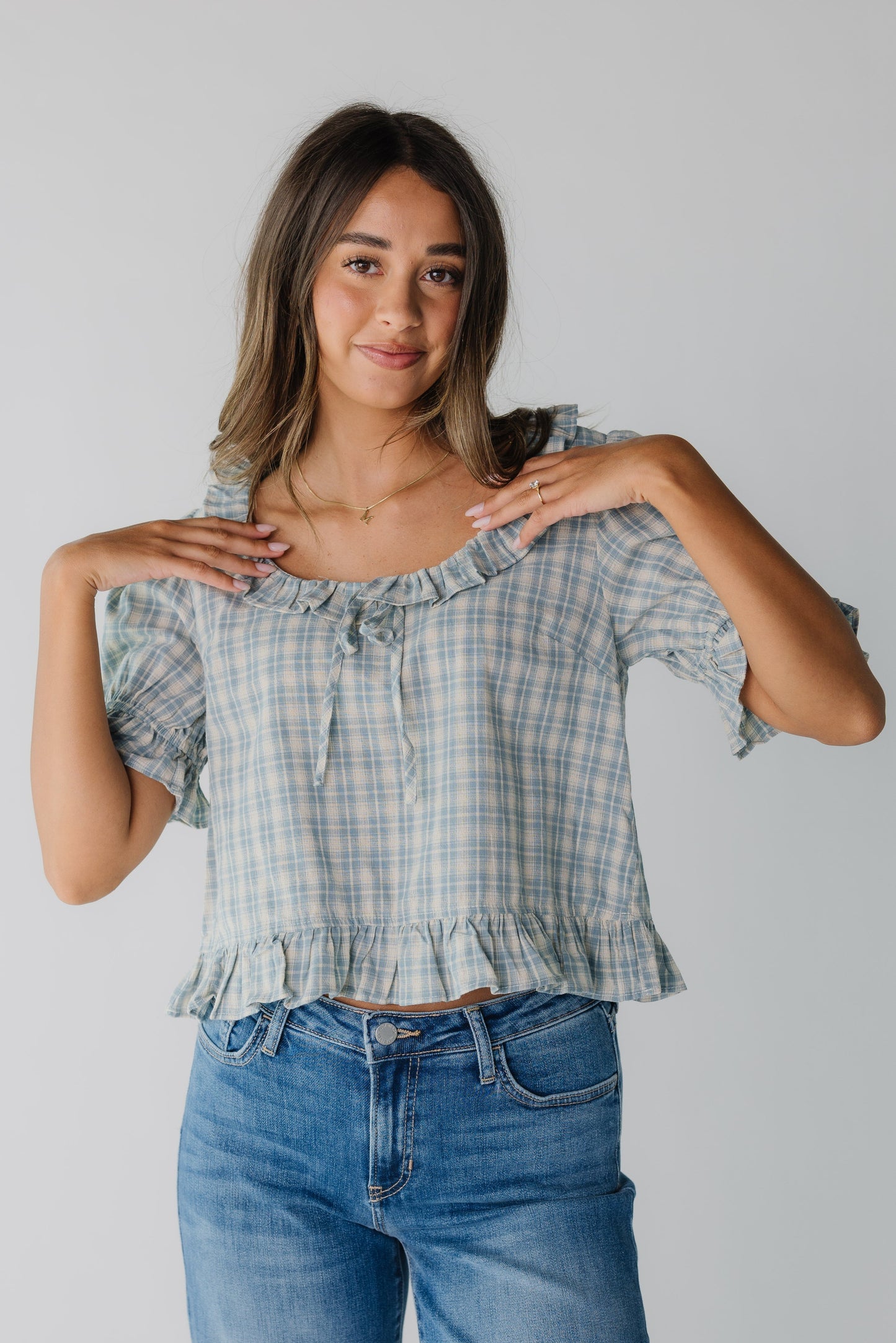 Modest women's blue plaid top with scoop neckline and short sleeves