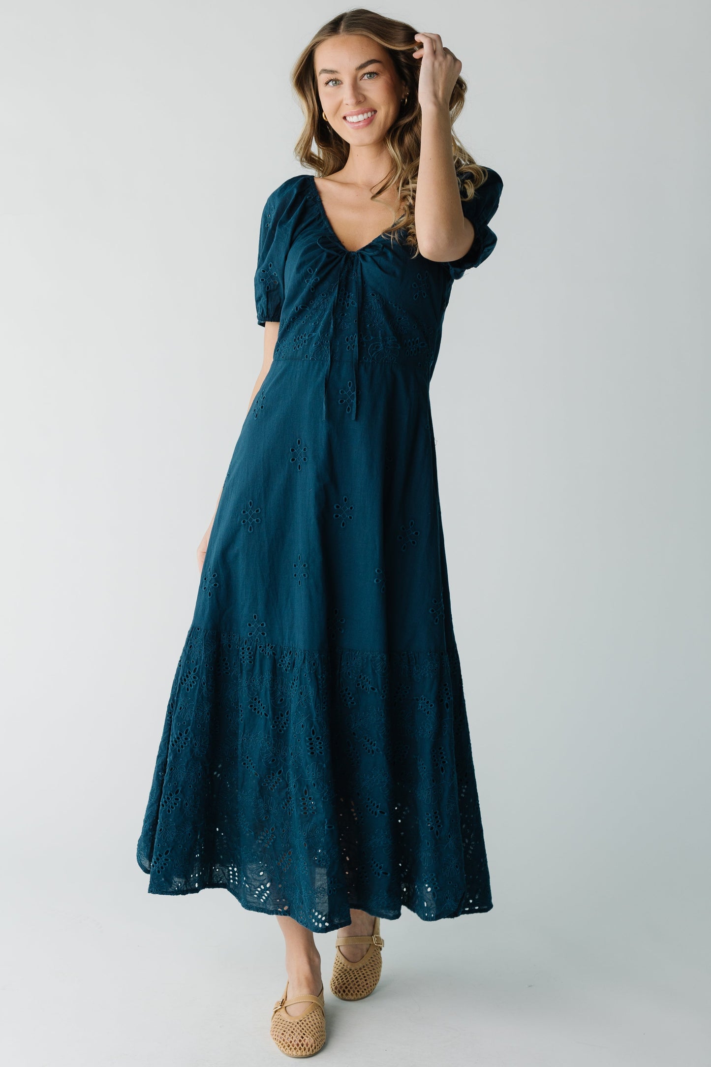 Navy eyelet dress with close fitting bodice and long A-line skirt