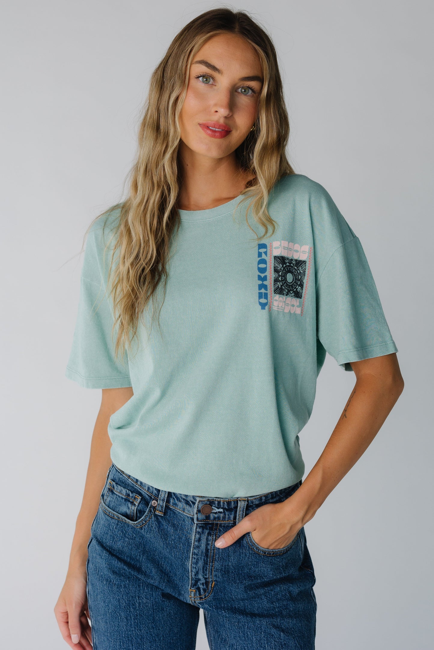 Modest light teal Roxy tee with crew neckline and short sleeves