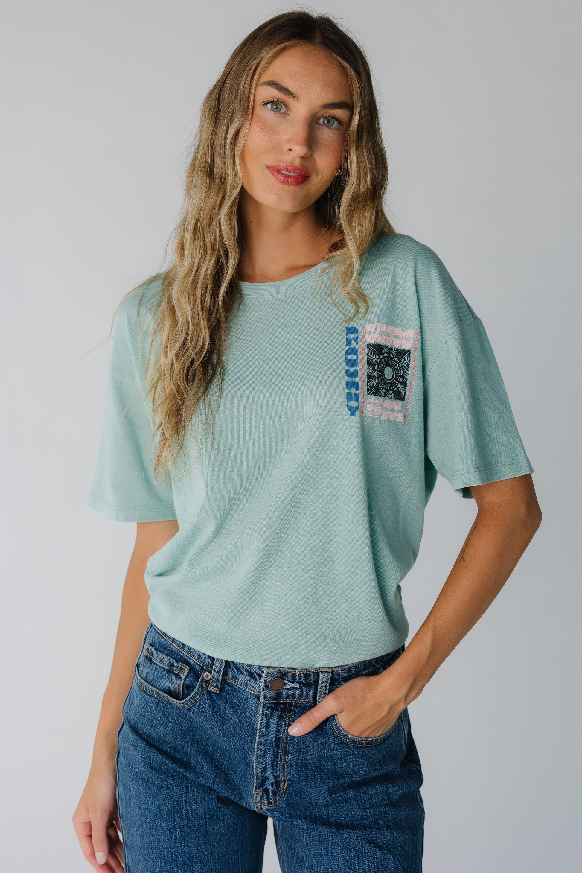 Modest light teal Roxy tee with crew neckline and short sleeves