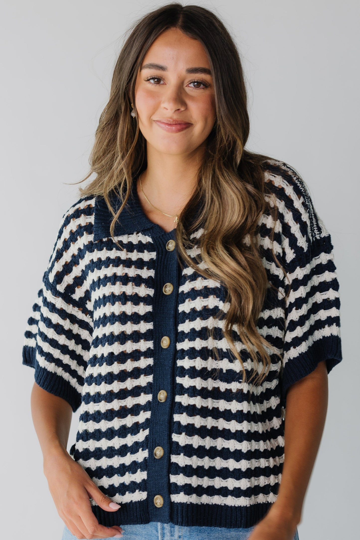 Modest navy and white cardigan with V-neckline and short sleeves
