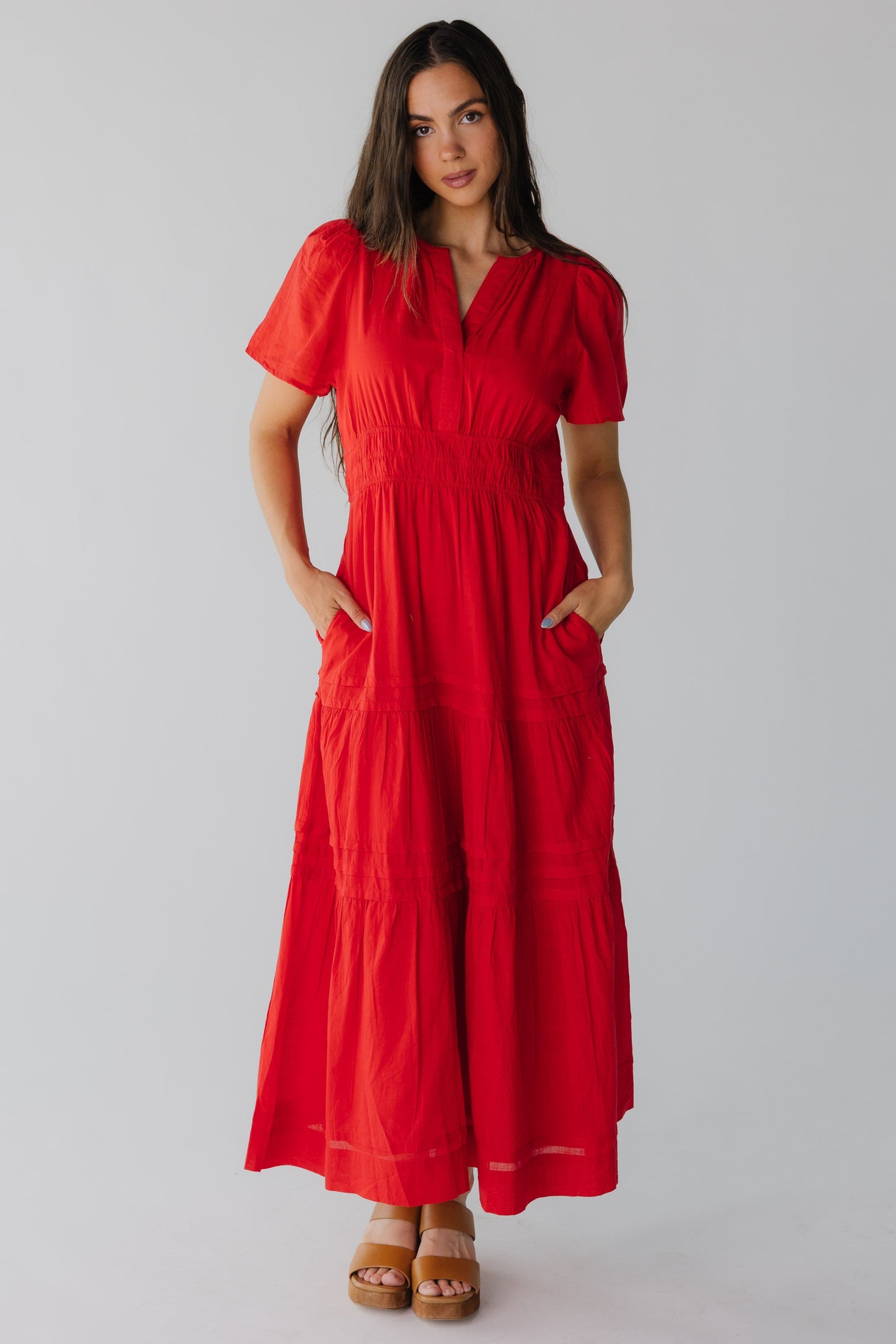 Red midi dress with multiple gathered tiers and side pockets