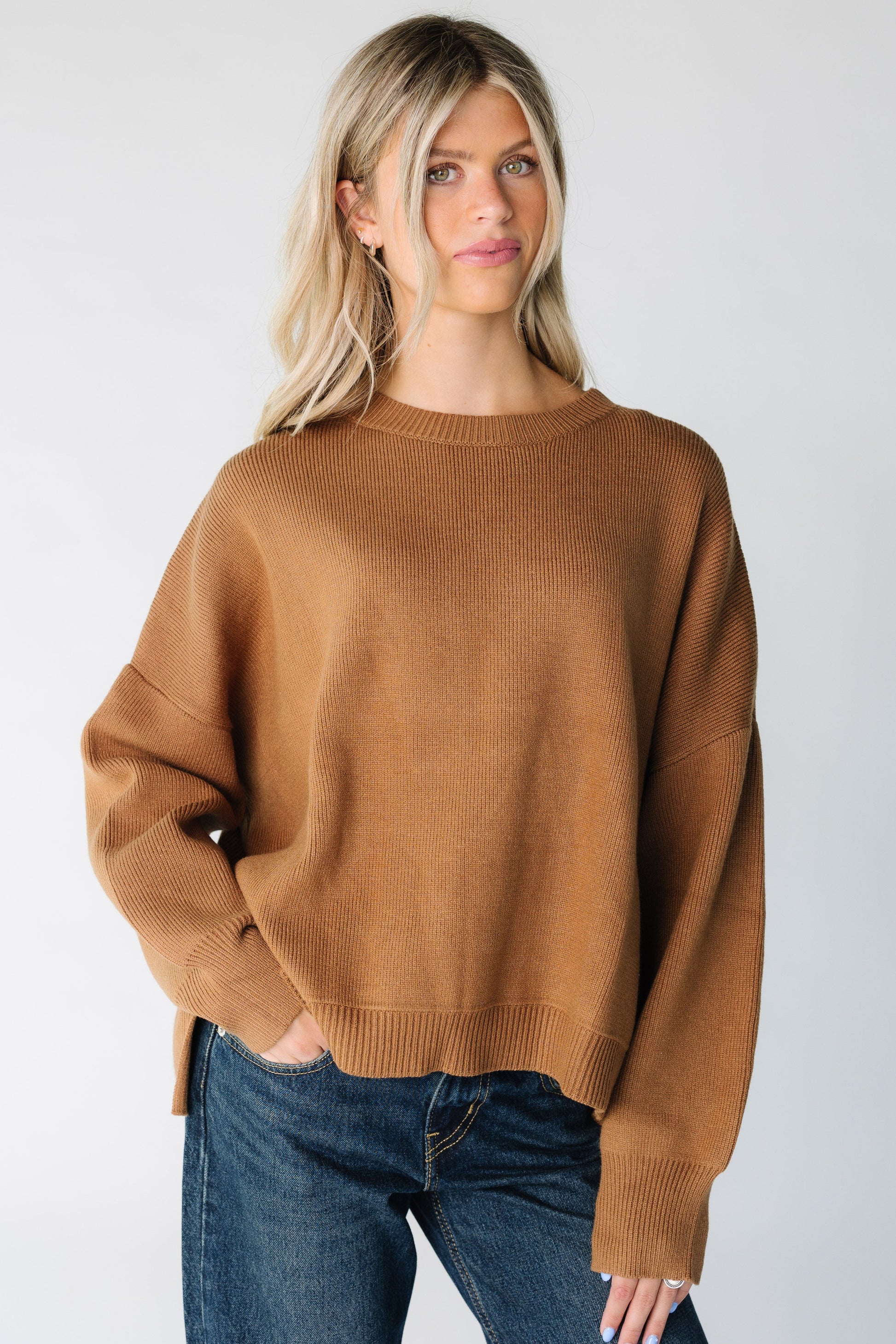 Modest women's loose fitting sweater with long sleeves in brown