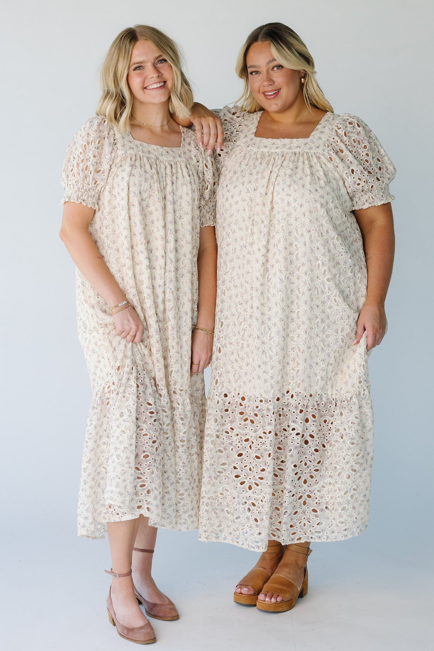 Eyelet floral dress available in multiple sizes with square neckline and wide bottom ruffle