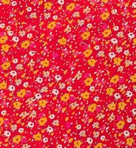 Red floral print fabric swatch.
