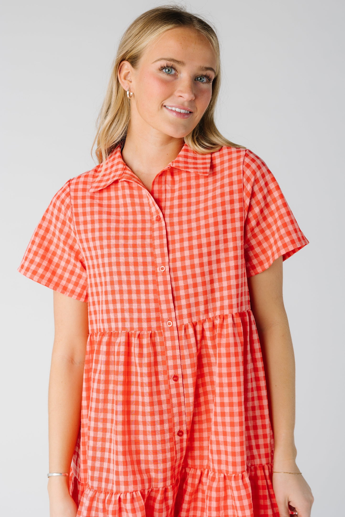 Close view of button down gingham dress with short sleeves