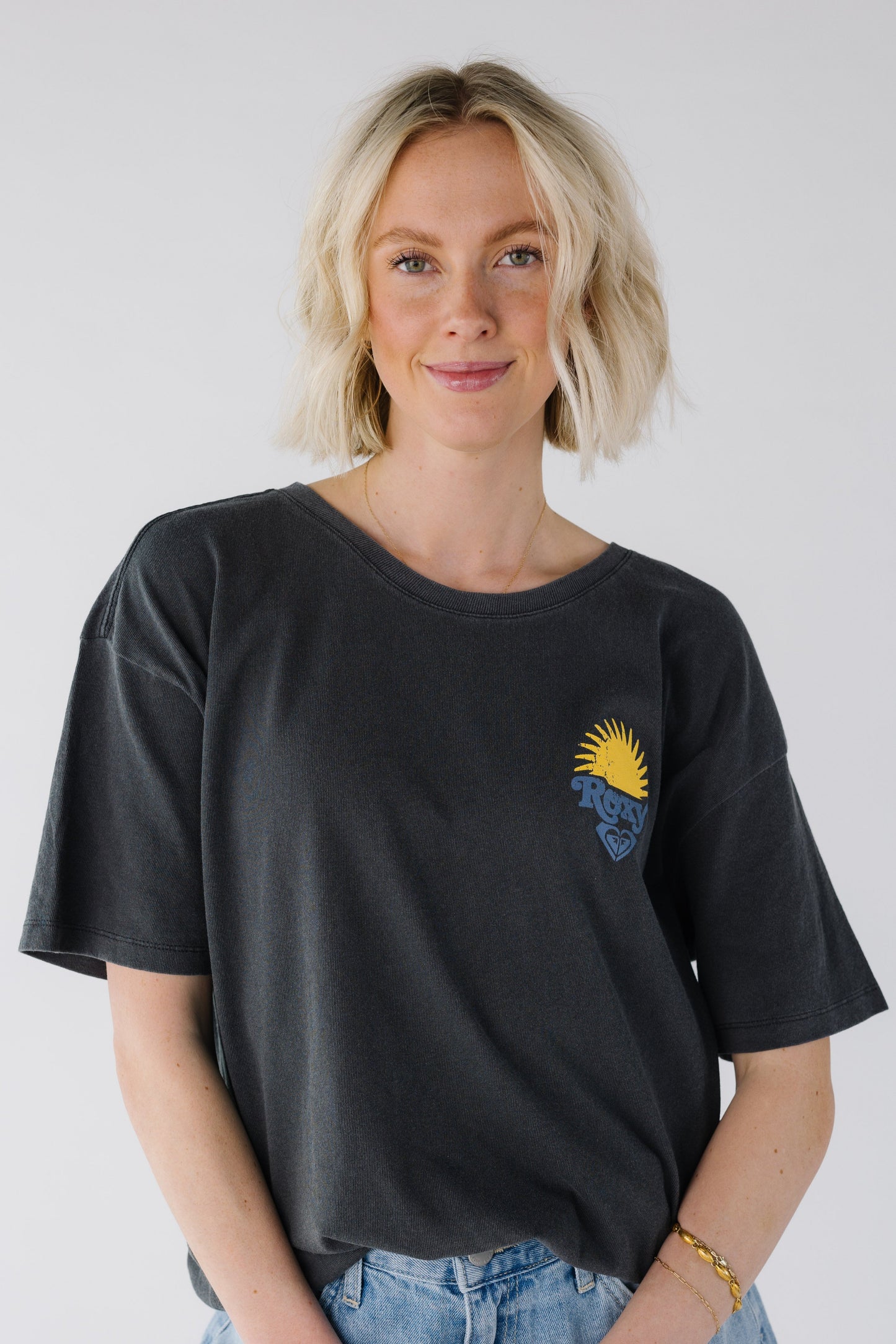 Close up black tee with small front graphic