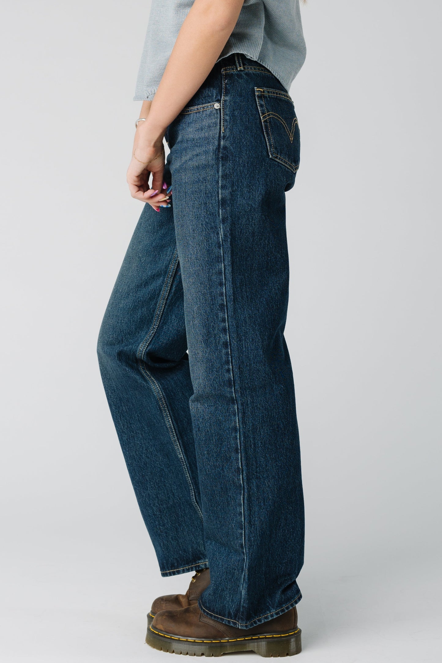 Side view of dark denim Levi's jeans A5566