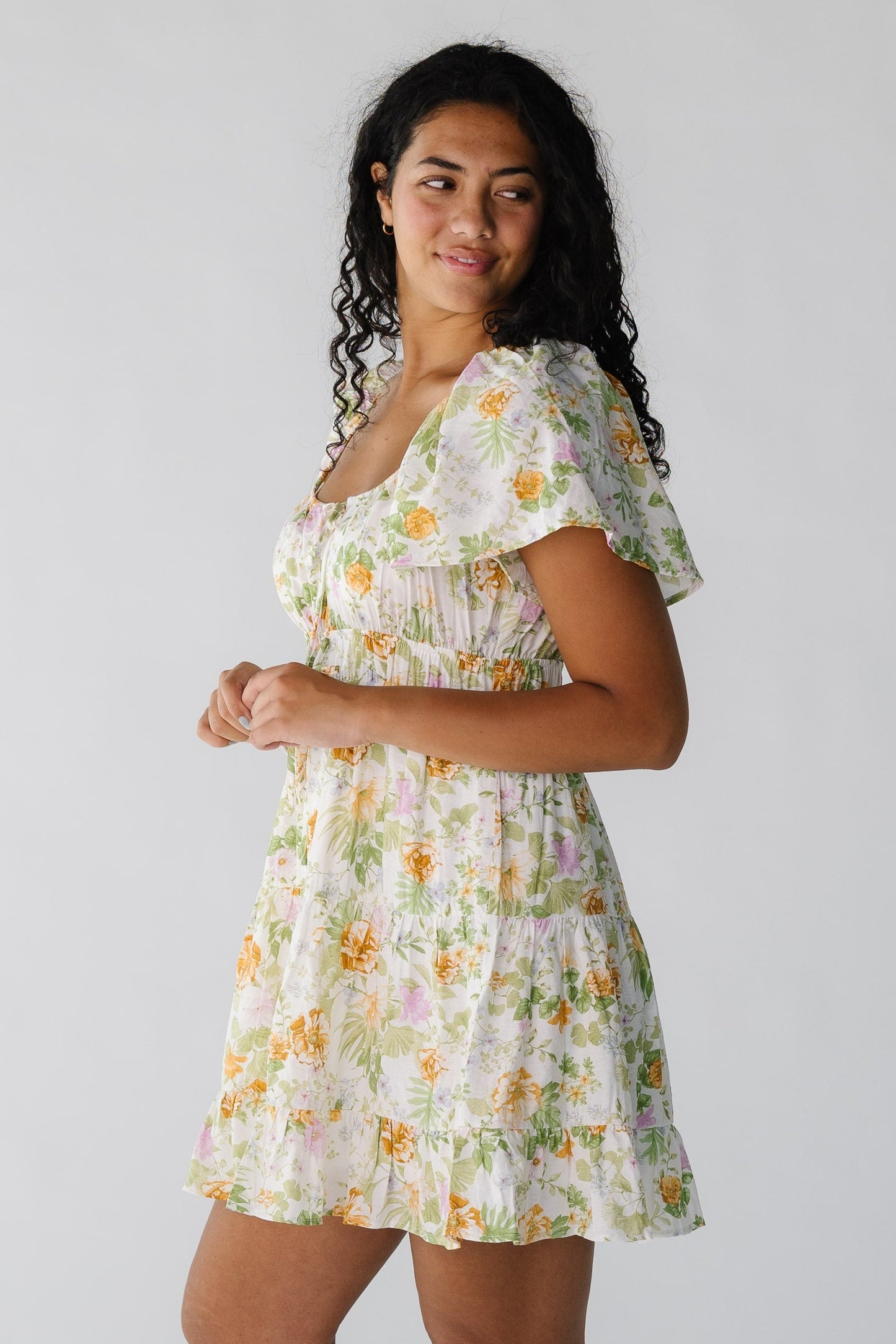 Side view of short sleeve floral mini dress