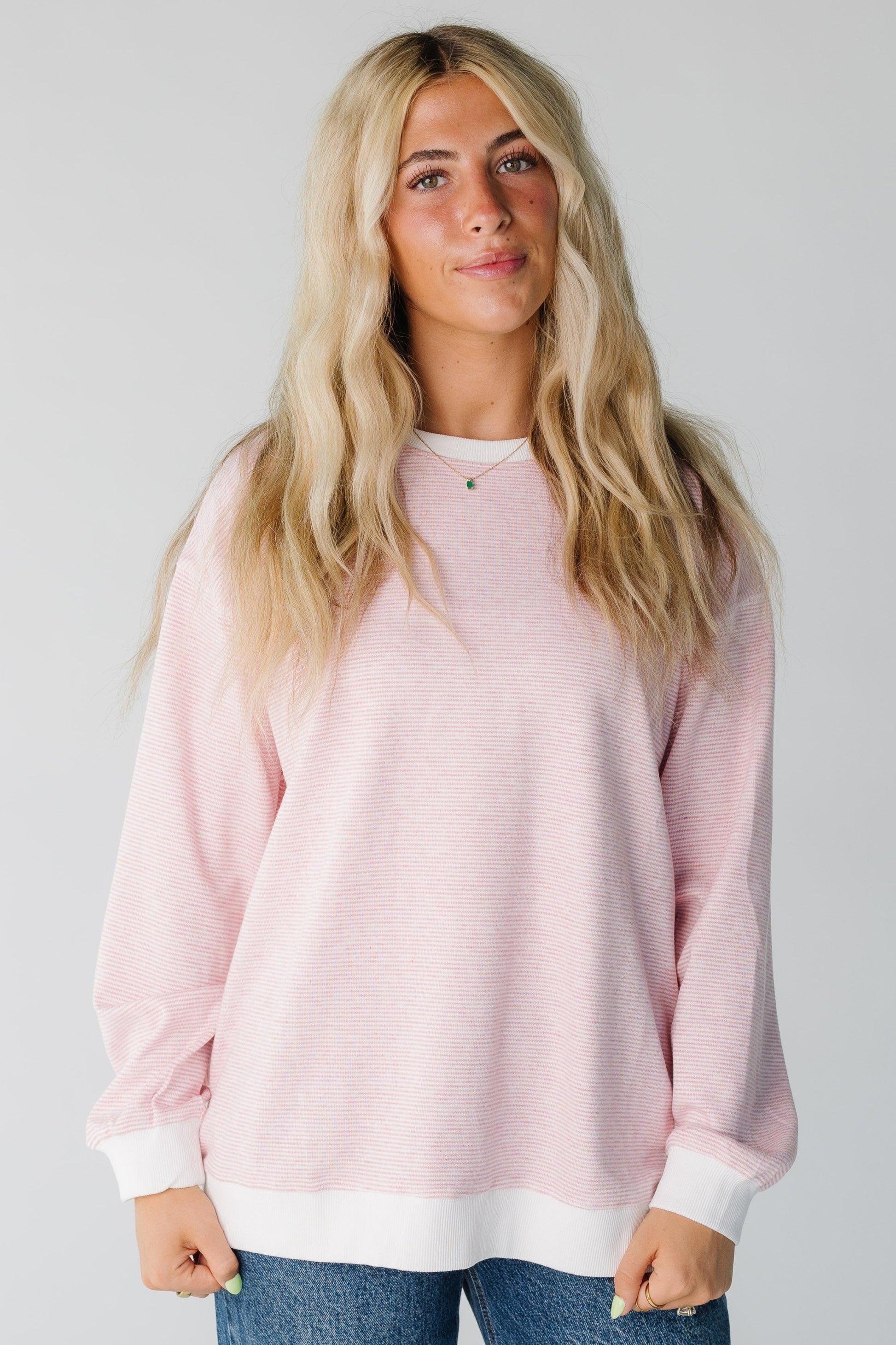 Modest pink stripe sweatshirt with long sleeves and crew neckline
