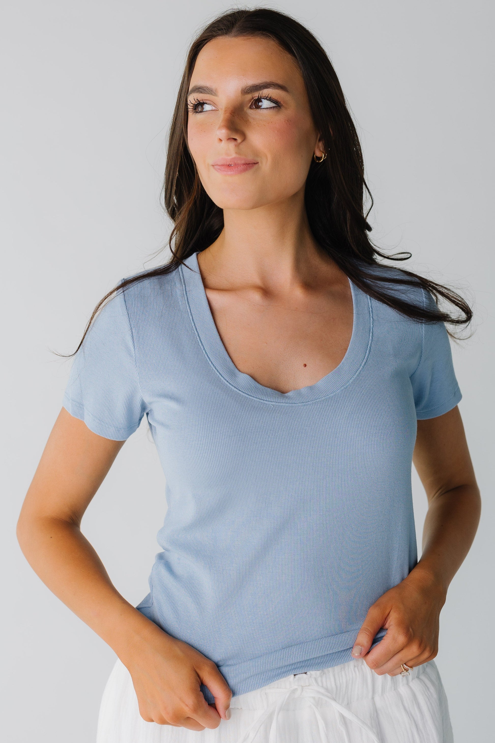Modest blue ribbed top with scoop neckline and short sleeves