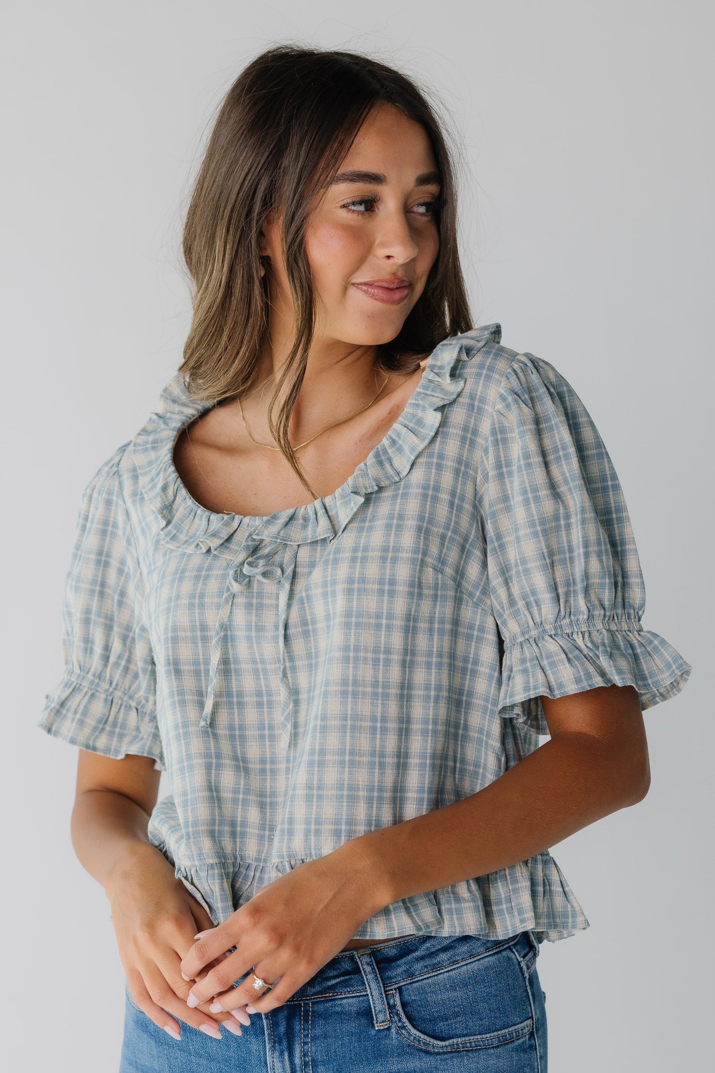 Blue plaid top for women with ruffle details