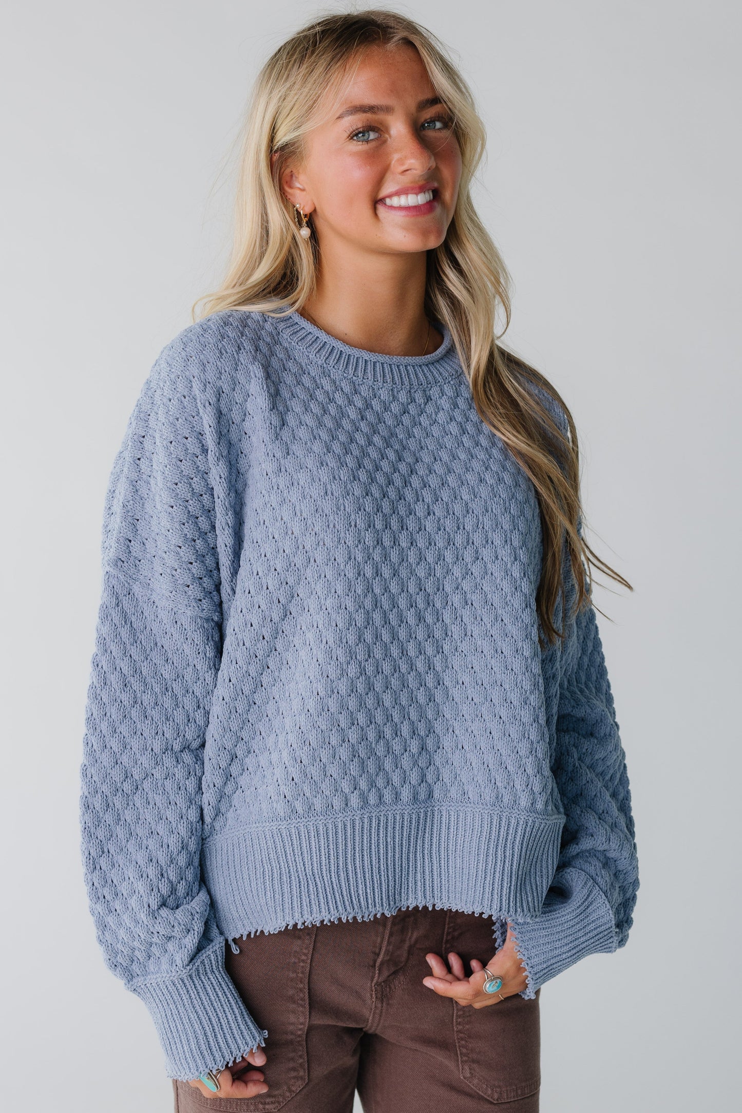 Modest blue texture knit sweater with long sleeves and rolled neckline