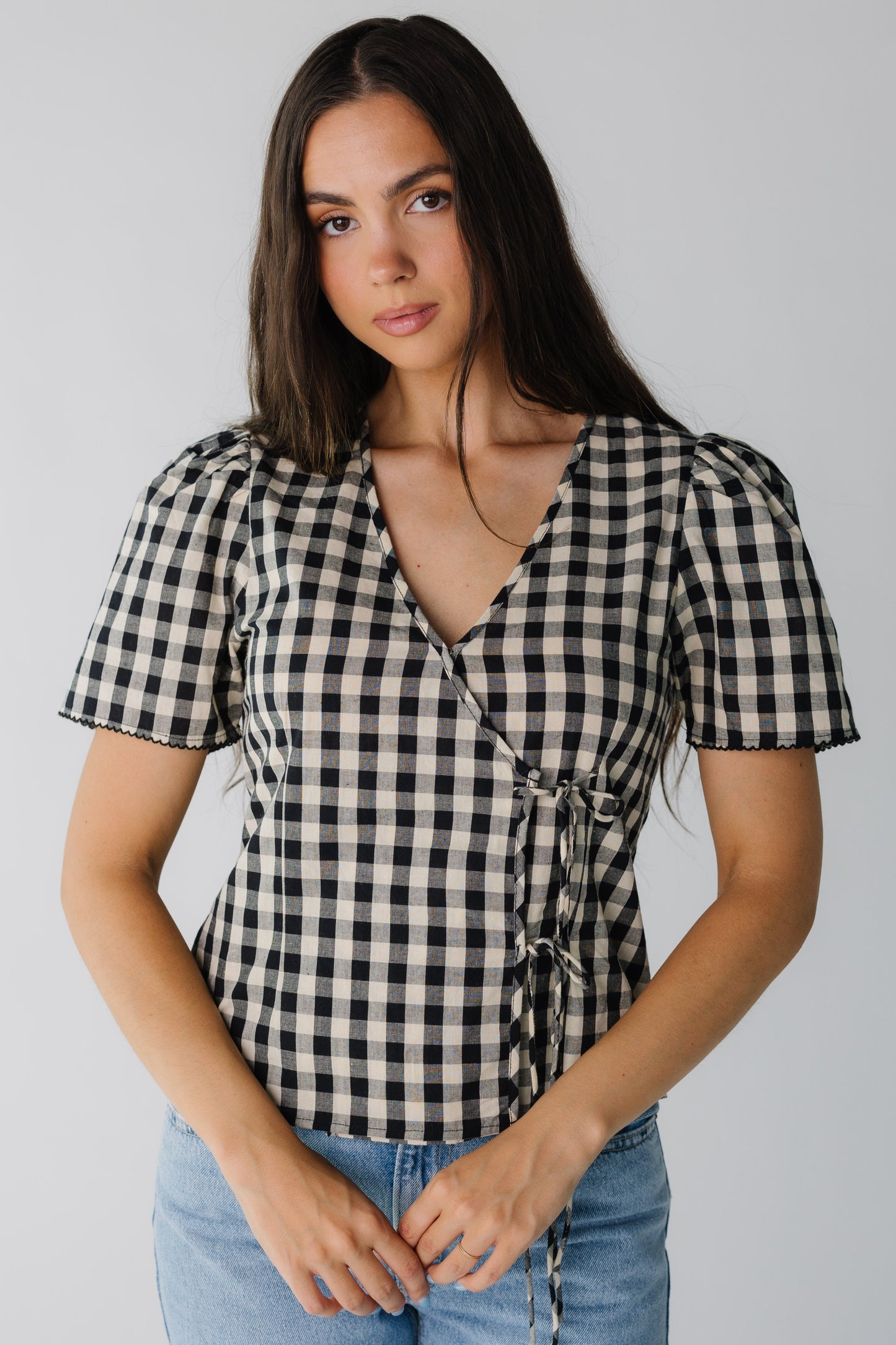 Cream and black gingham wrap top with two front tie closure