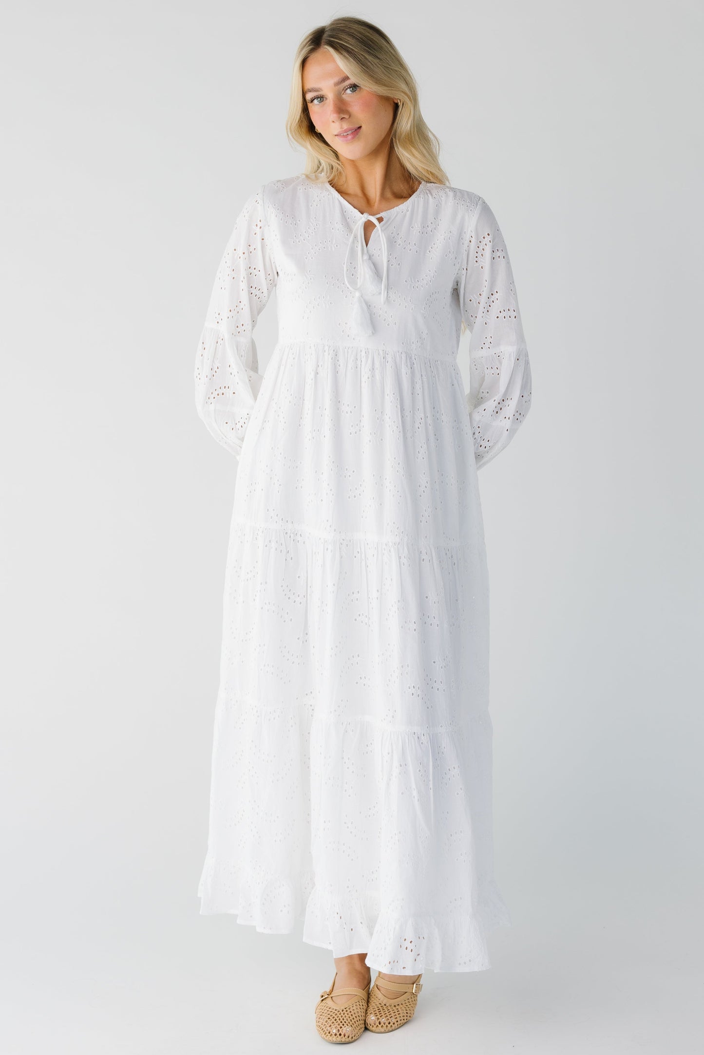 White eyelet tiered dress with long sleeves