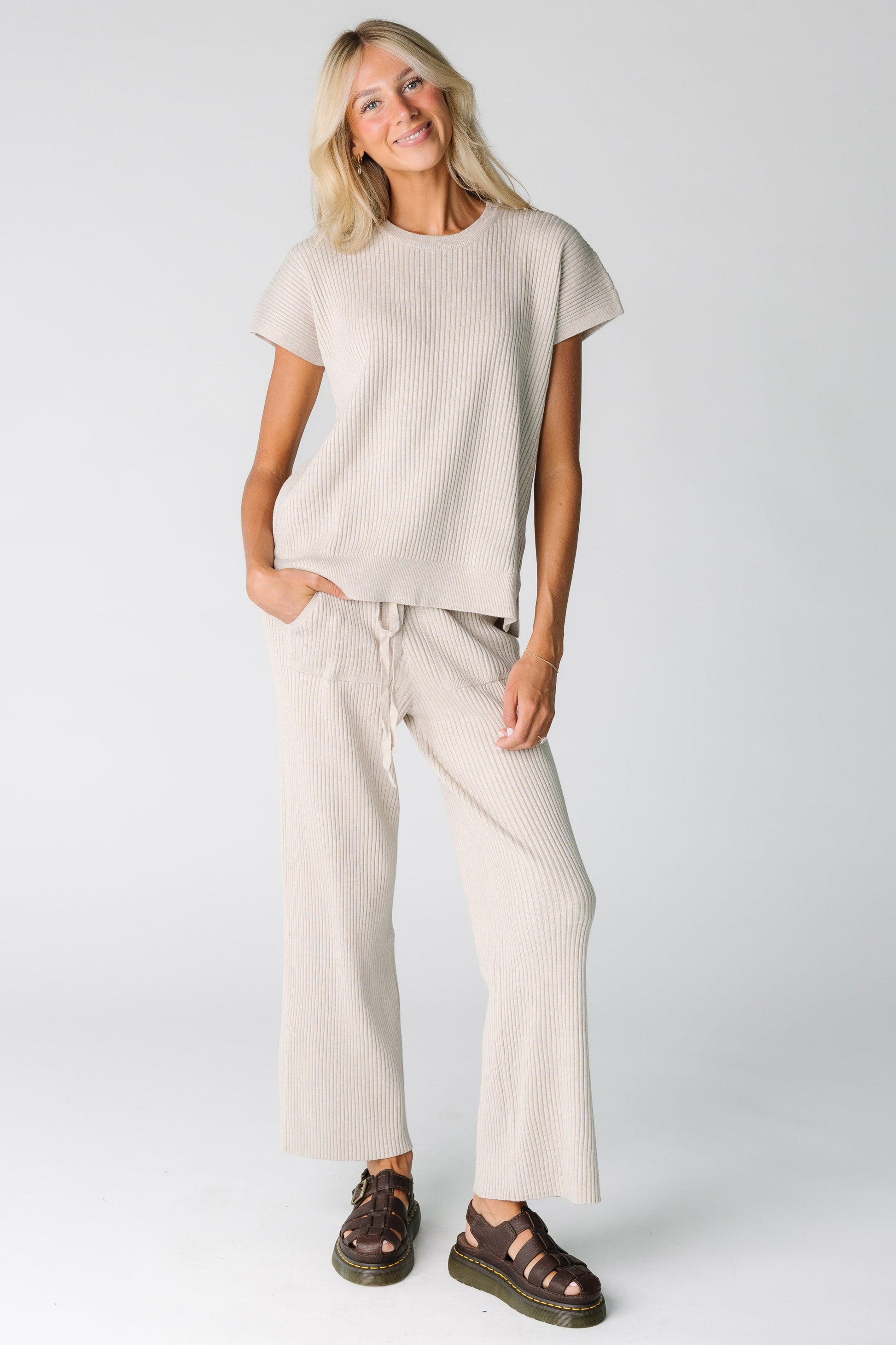 Woman wearing a warm grey ribbed sweater set