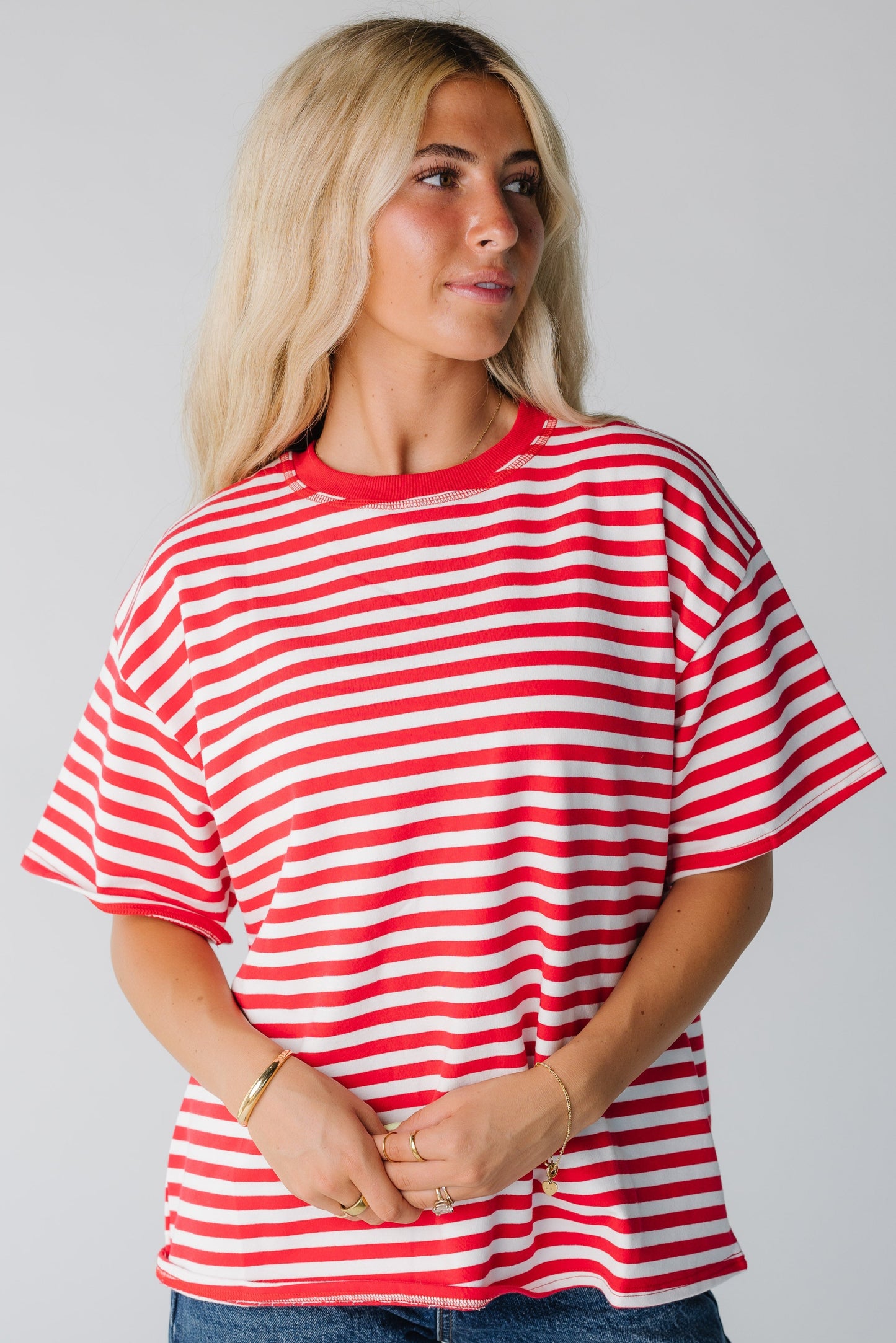 Woman wearing red and white stripe tee with short sleeves
