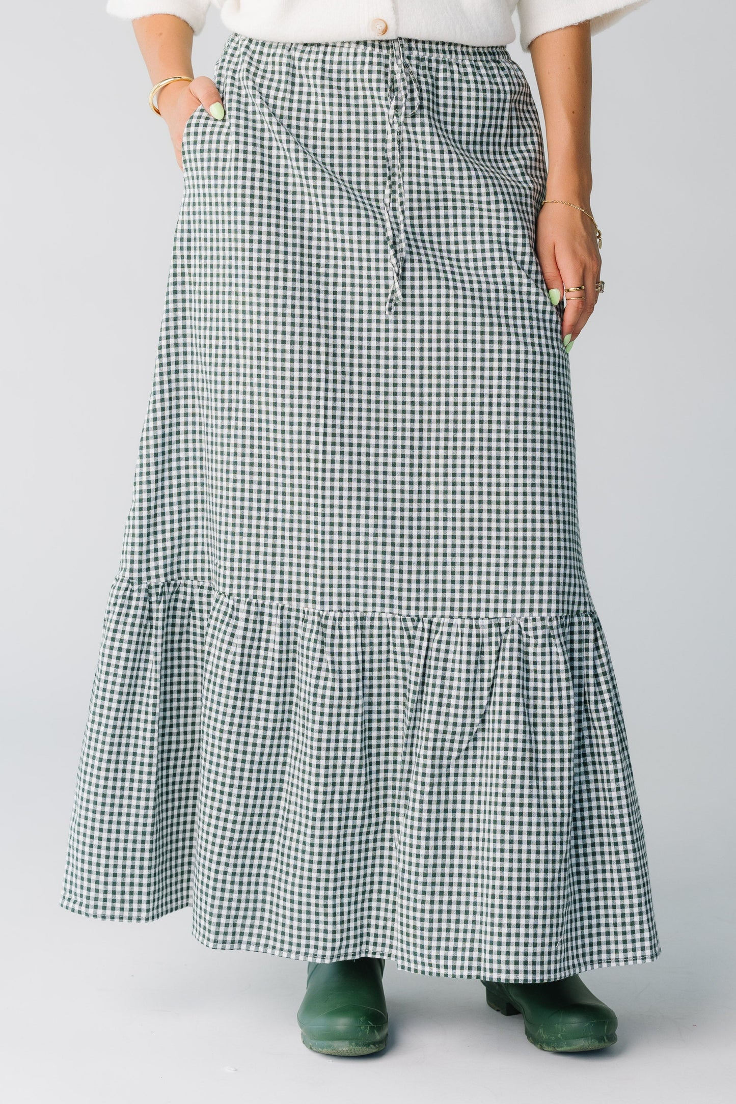 Women wearing forest green gingham maxi skirt