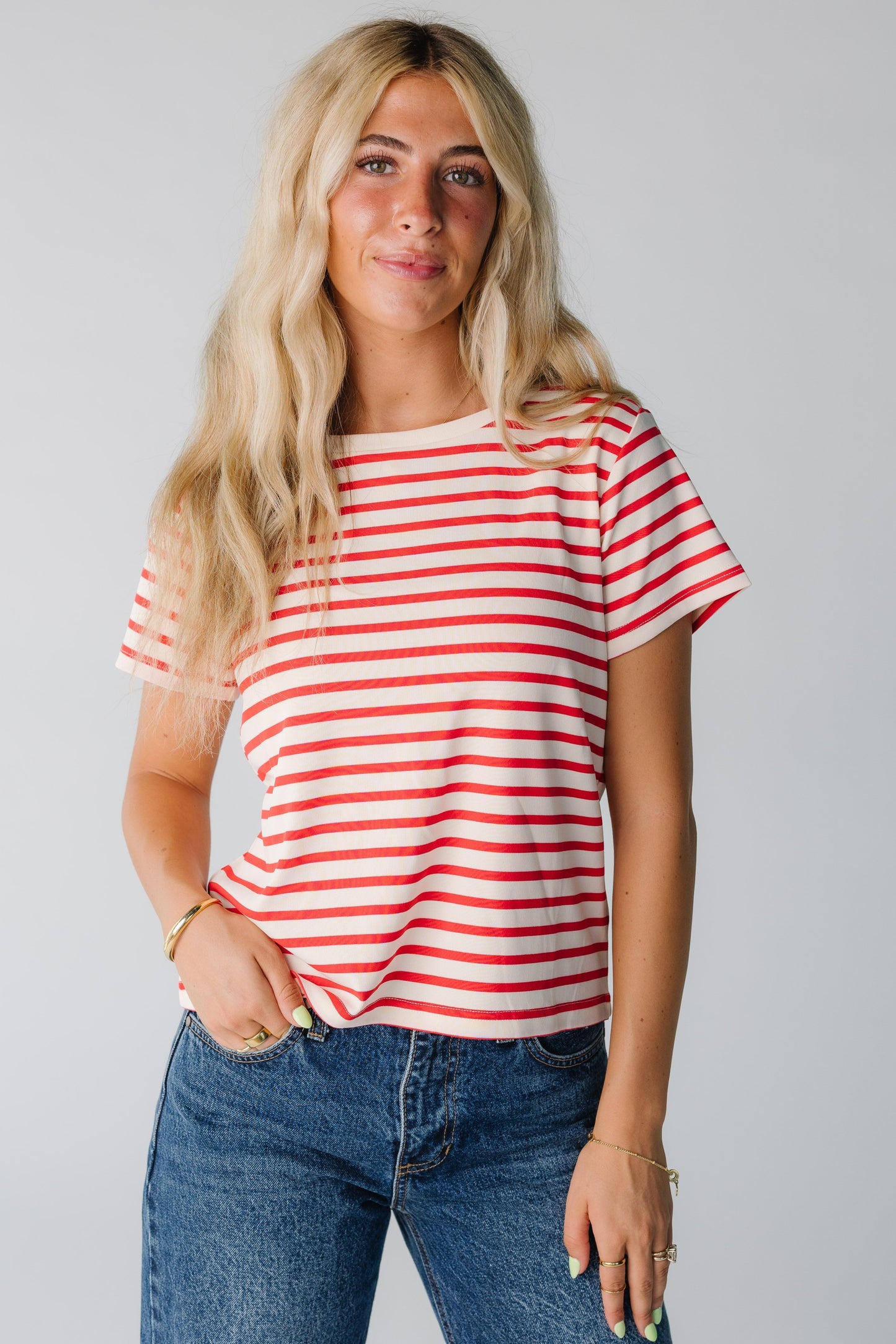 Woman wearing red and white stripe short sleeve tee