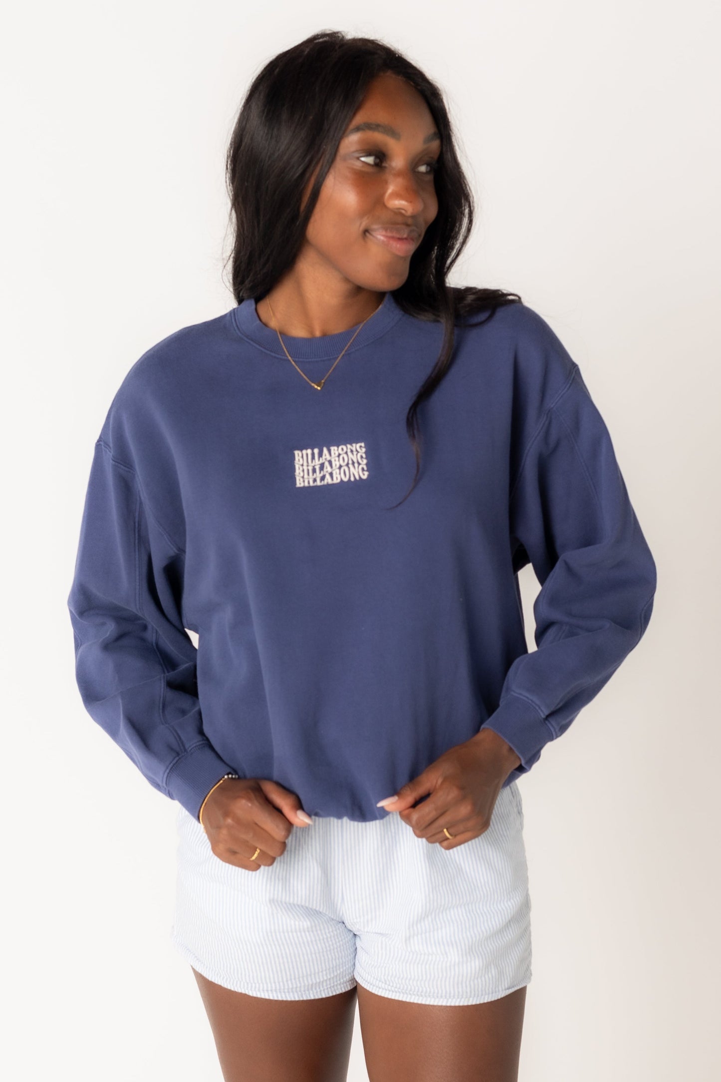 Modest women's long sleeve sweatshirt by Billabong with crew neckline and small front graphic