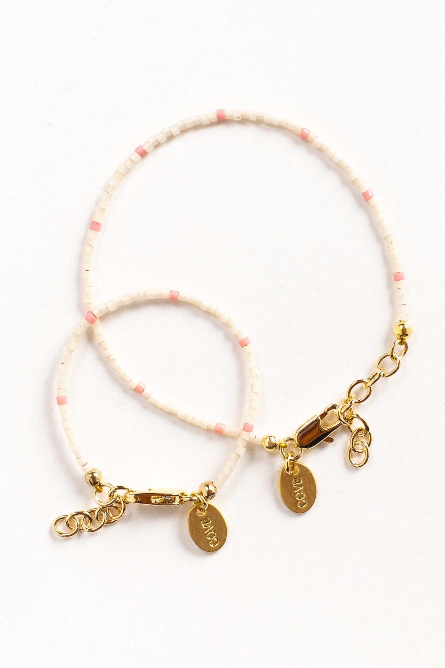 Baby bracelet in white and pink seed beads