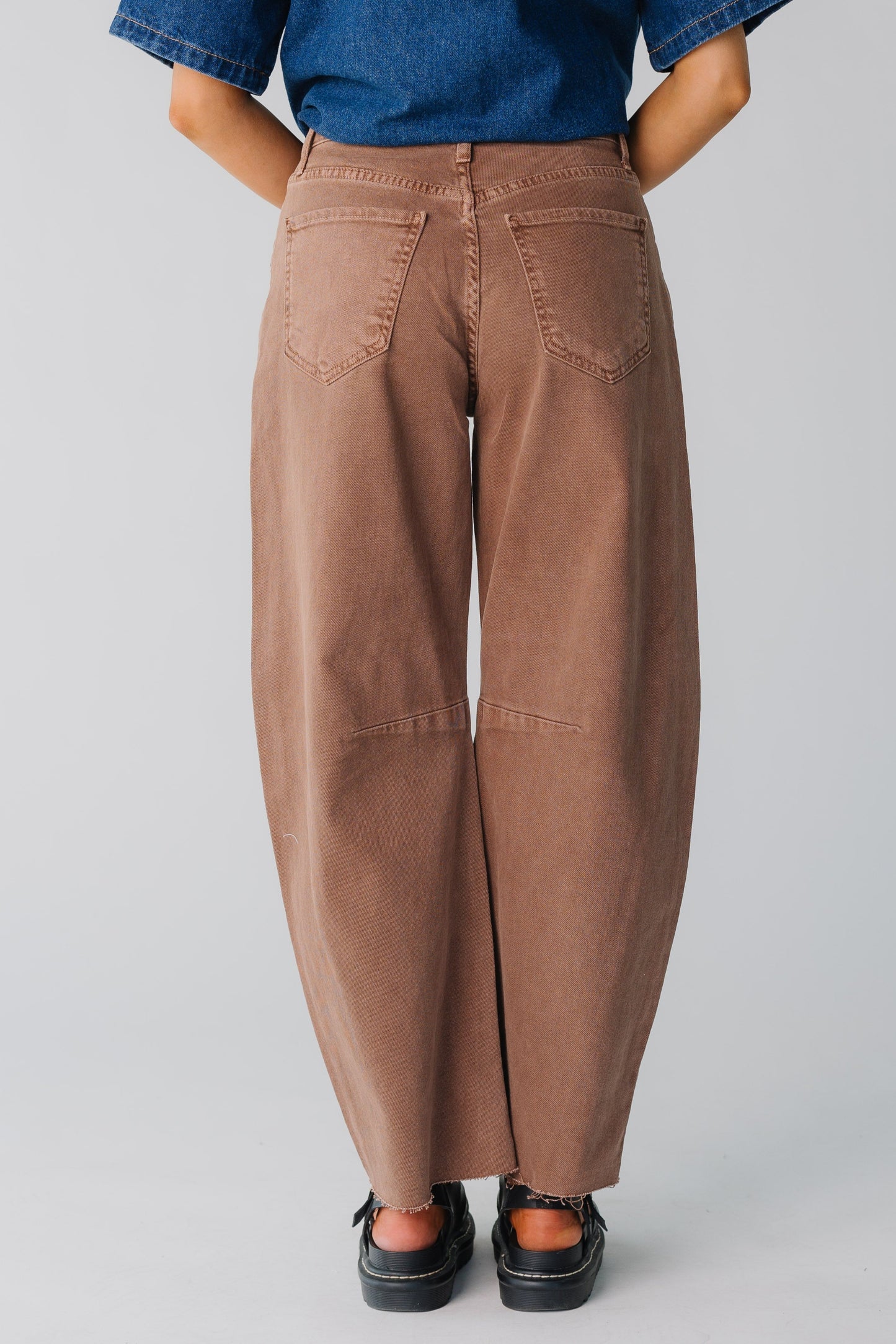 Back view of women wearing brown very wide leg jeans