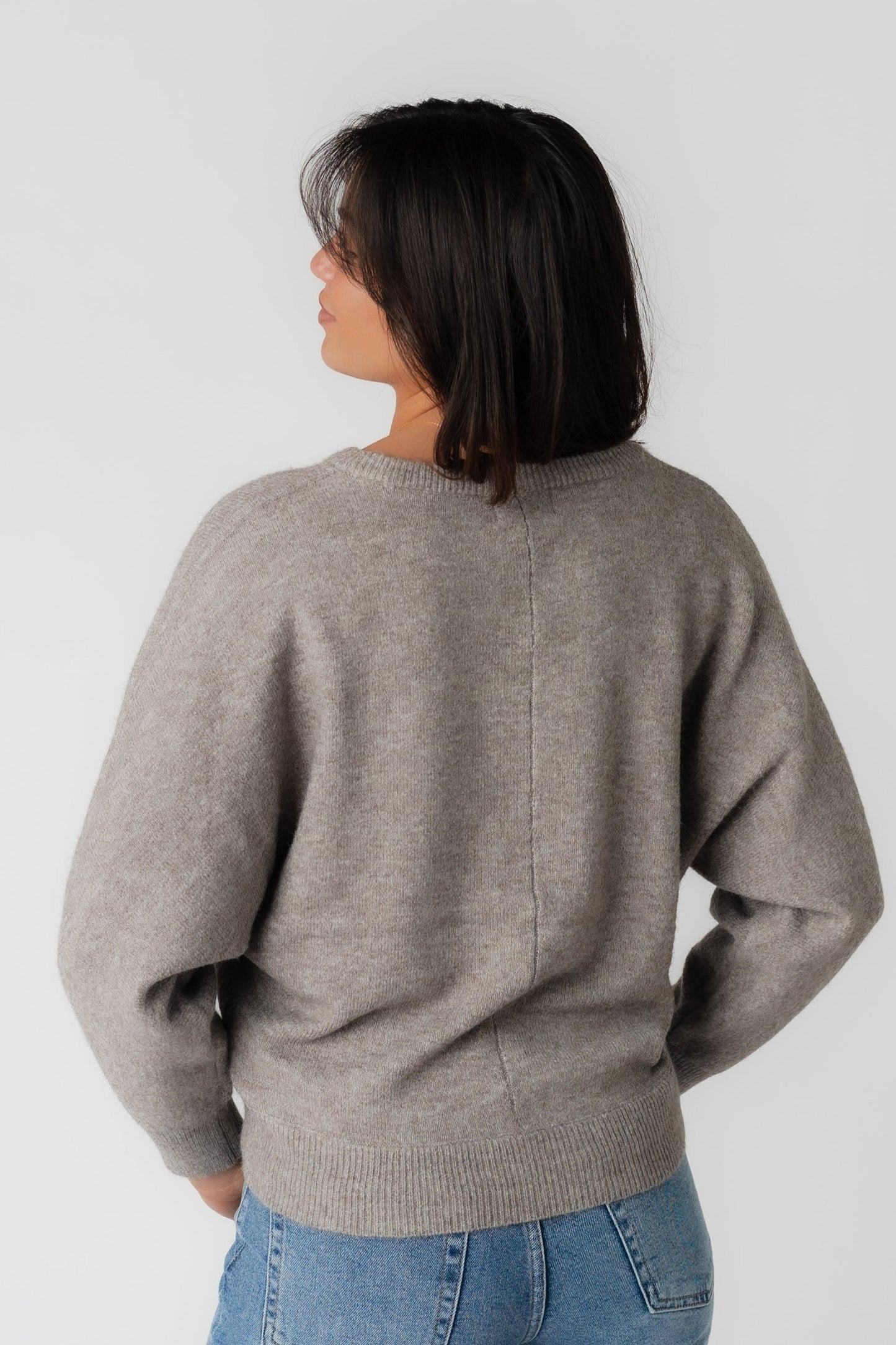 Back view of light mocha long sleeve sweater