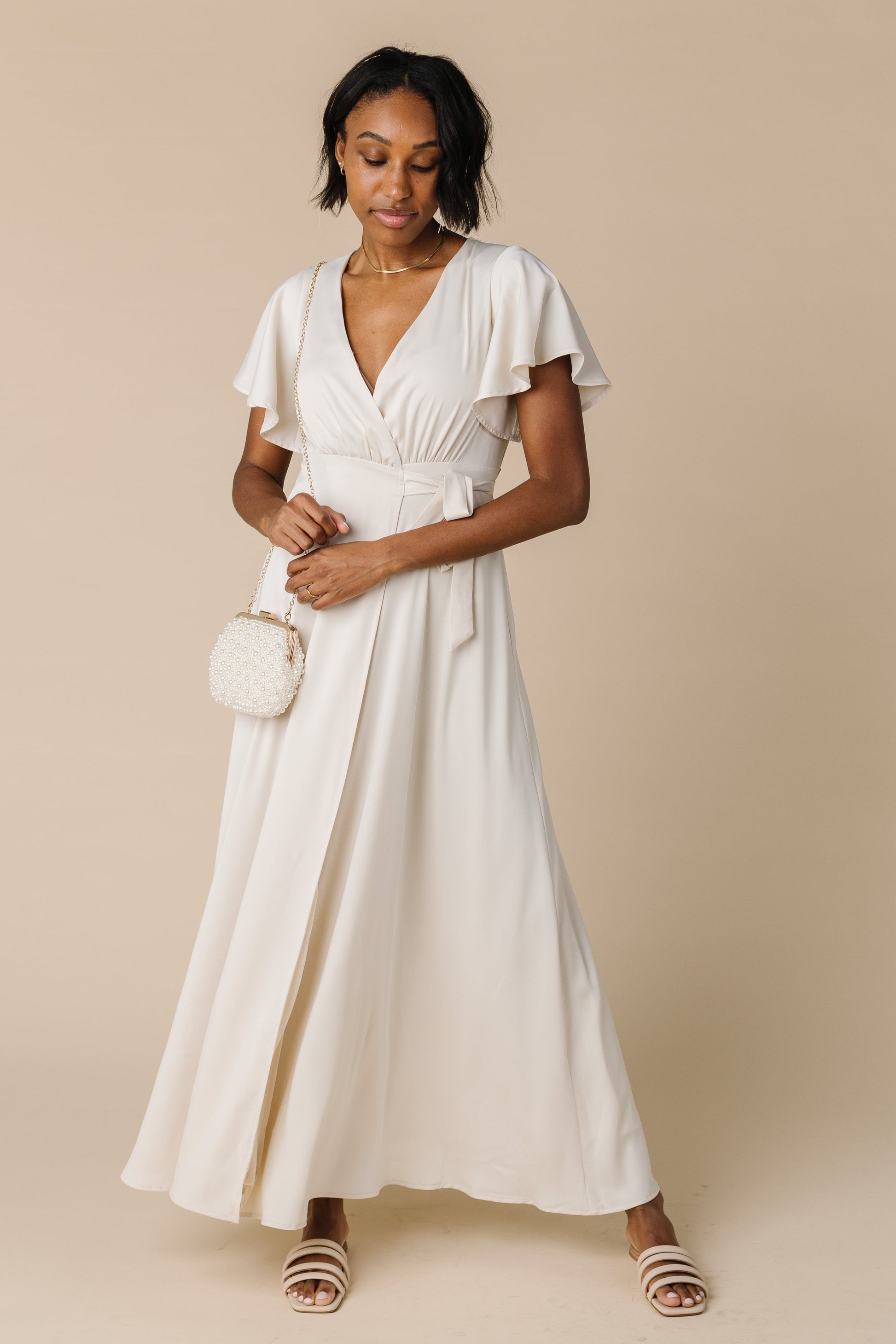 Wrap maxi dress in cream by Brass and Roe