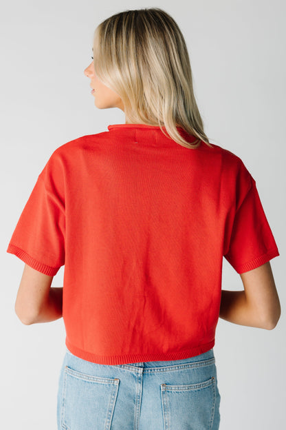 Back view of red short sleeve top