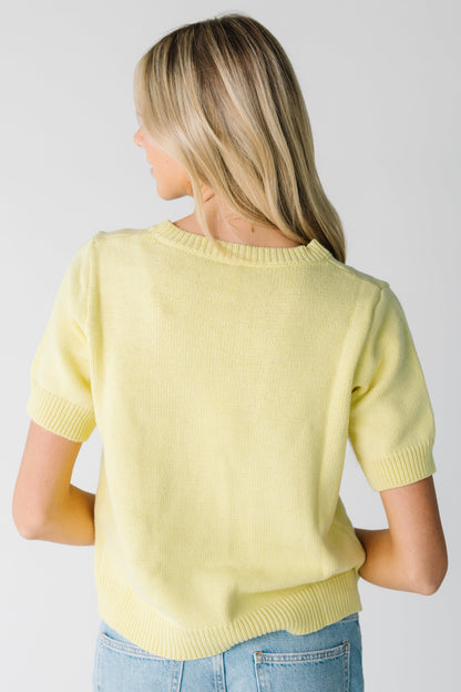 Back view of yellow crew neck sweater